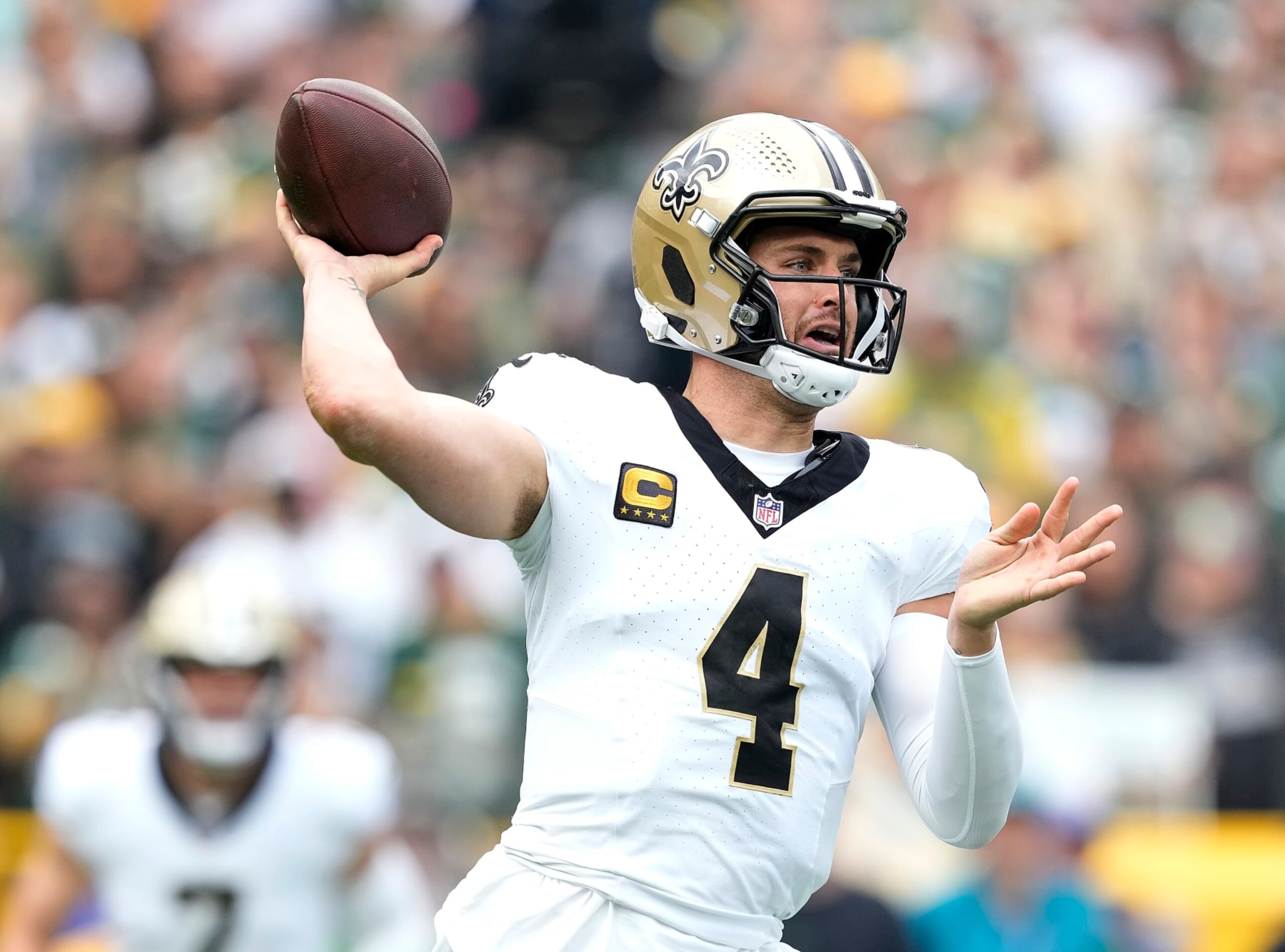 GREEN BAY, WISCONSIN - SEPTEMBER 24: Derek Carr #4 of the New Orleans Saints attempts a pass during the first quarter against the Green Bay Packers at Lambeau Field on September 24, 2023 in Green Bay, Wisconsin. (Photo by Patrick McDermott/Getty Images)