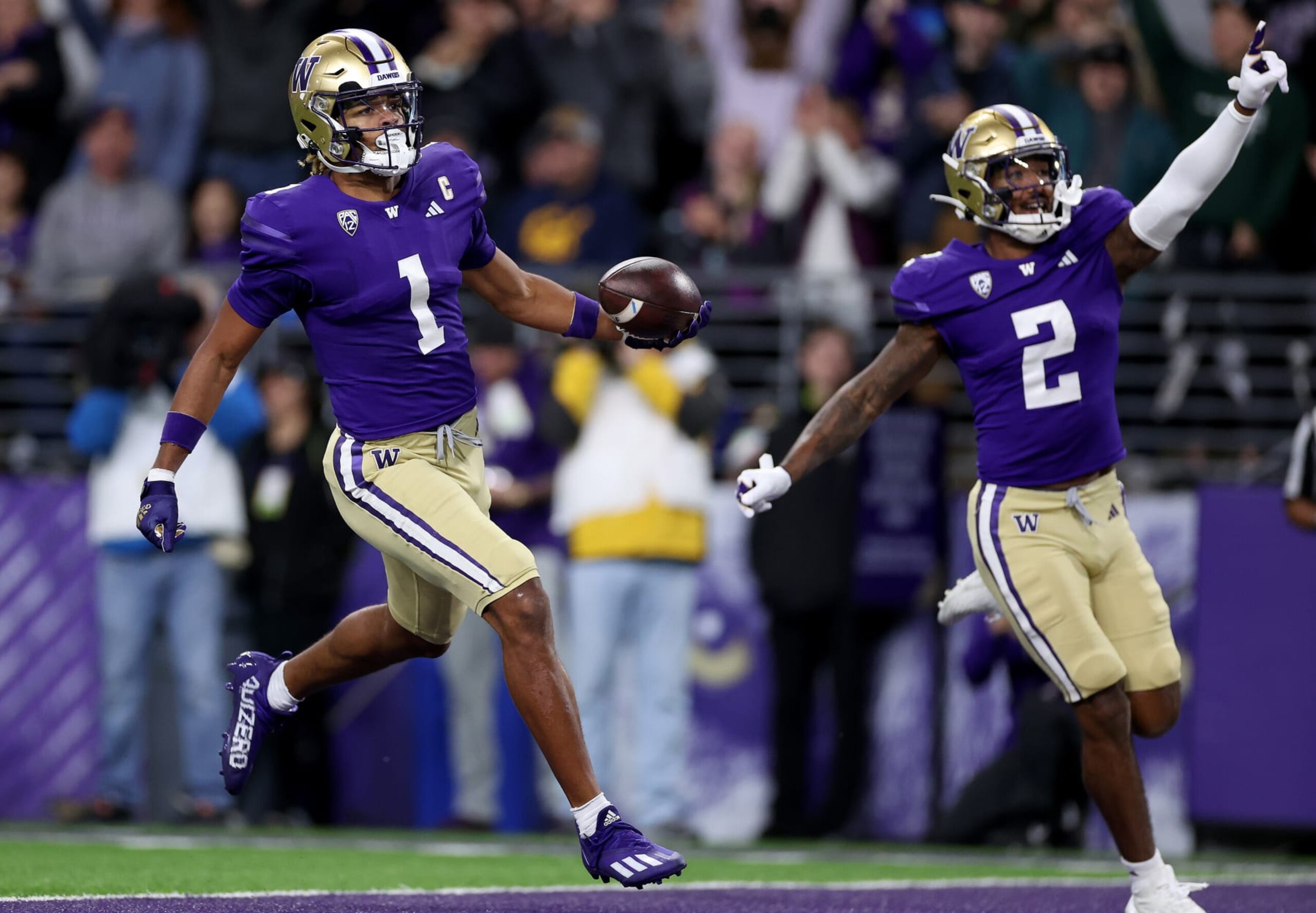 SEATTLE, WASHINGTON - SEPTEMBER 23: Rome Odunze #1 of the Washington Huskies celebrates his touchdown with Ja'Lynn Polk #2 during the first quarter against the California Golden Bears at Husky Stadium on September 23, 2023 in Seattle, Washington. (Photo by Steph Chambers/Getty Images)
