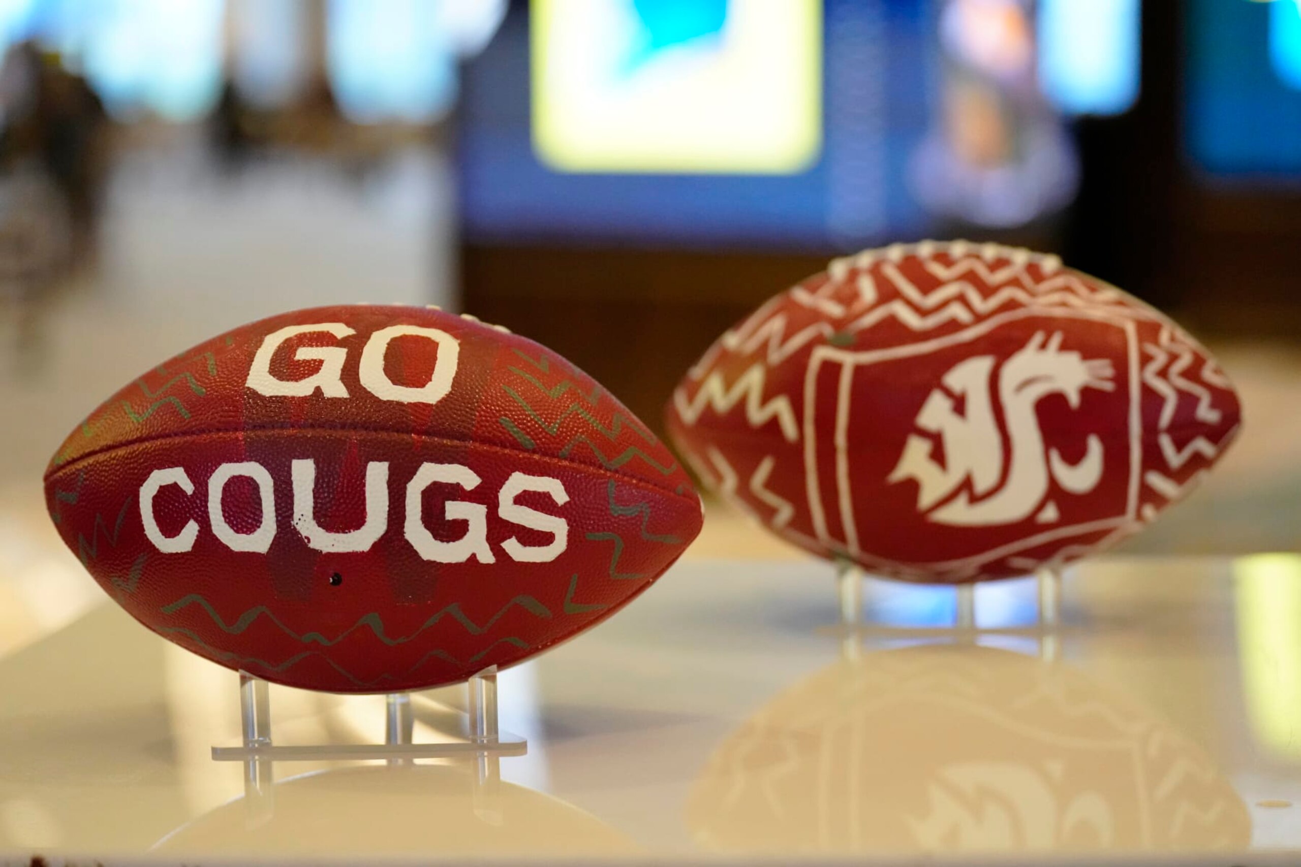 LAS VEGAS, NEVADA - JULY 21: Custom painted Pac-12 Washington State Cougars football on display at Zouk Nightclub at Resorts World Las Vegas on July 21, 2023 in Las Vegas, Nevada. (Photo by Louis Grasse/Getty Images)