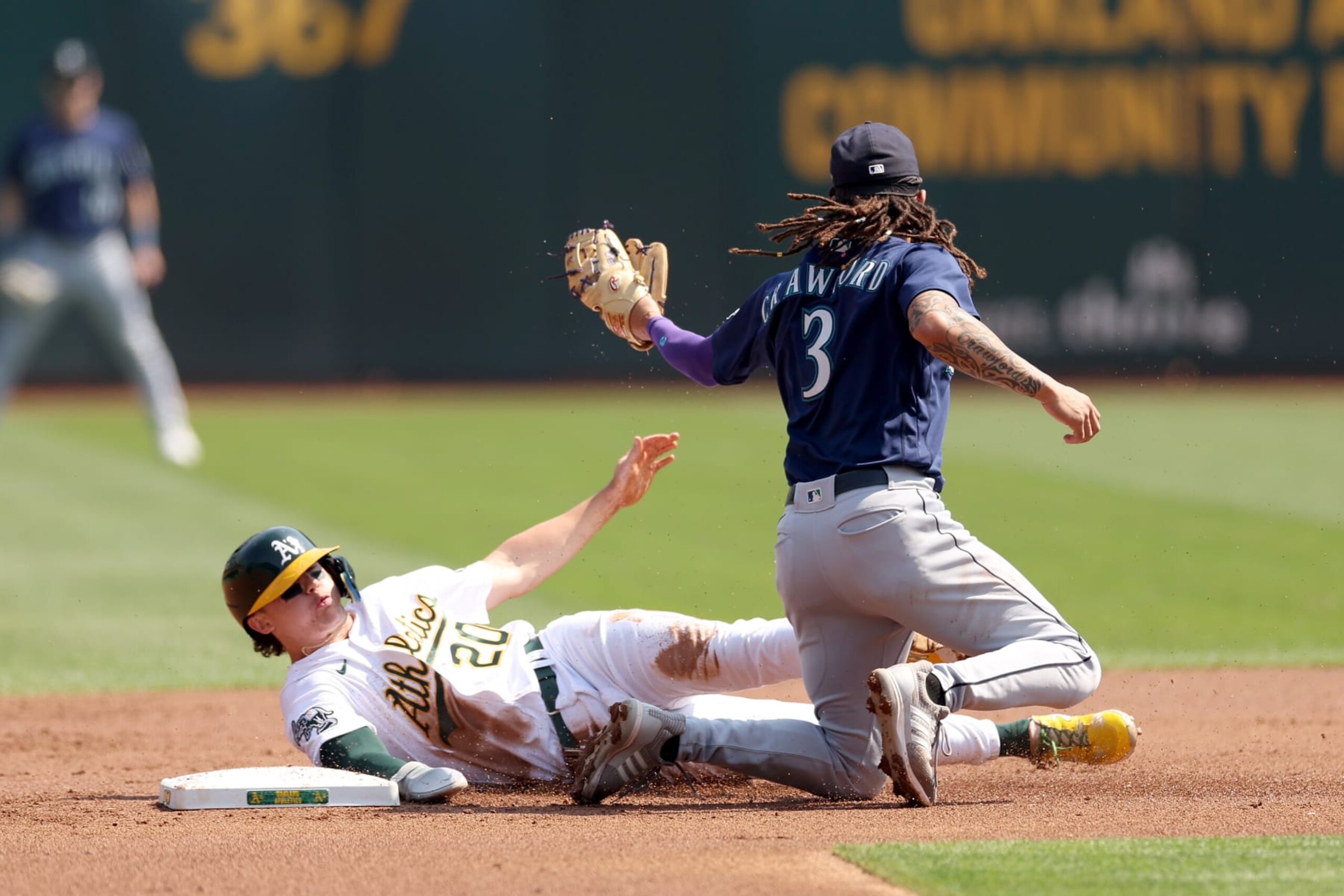 Oakland's Zack Gelof and Seattle's J.P. Crawford Oakland's Zack Gelof and Seattle's J.P. Crawford