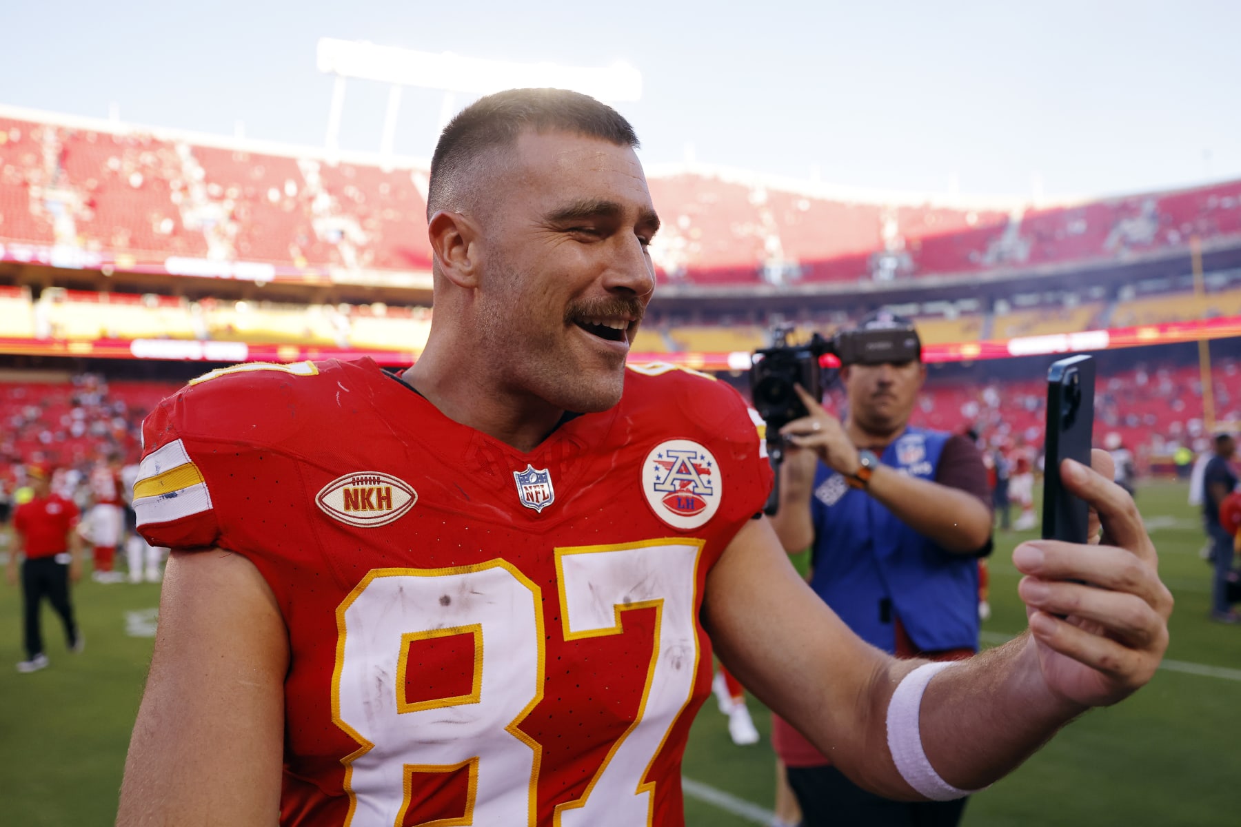 KANSAS CITY, MISSOURI - SEPTEMBER 24: Travis Kelce #87 of the Kansas City Chiefs talks on his phone after a game against the Chicago Bears at GEHA Field at Arrowhead Stadium on September 24, 2023 in Kansas City, Missouri. (Photo by David Eulitt/Getty Images)