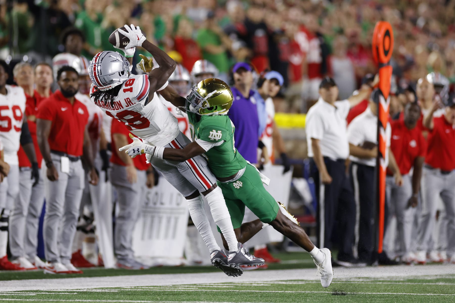 SOUTH BEND, IN - SEPTEMBER 23: Notre Dame Fighting Irish cornerback Benjamin Morrison (20) defends a pass against Ohio State Buckeyes wide receiver Marvin Harrison Jr. (18) during a college football game on September 23, 2023 at Notre Dame Stadium in South Bend, Indiana. (Photo by Joe Robbins/Icon Sportswire via Getty Images)