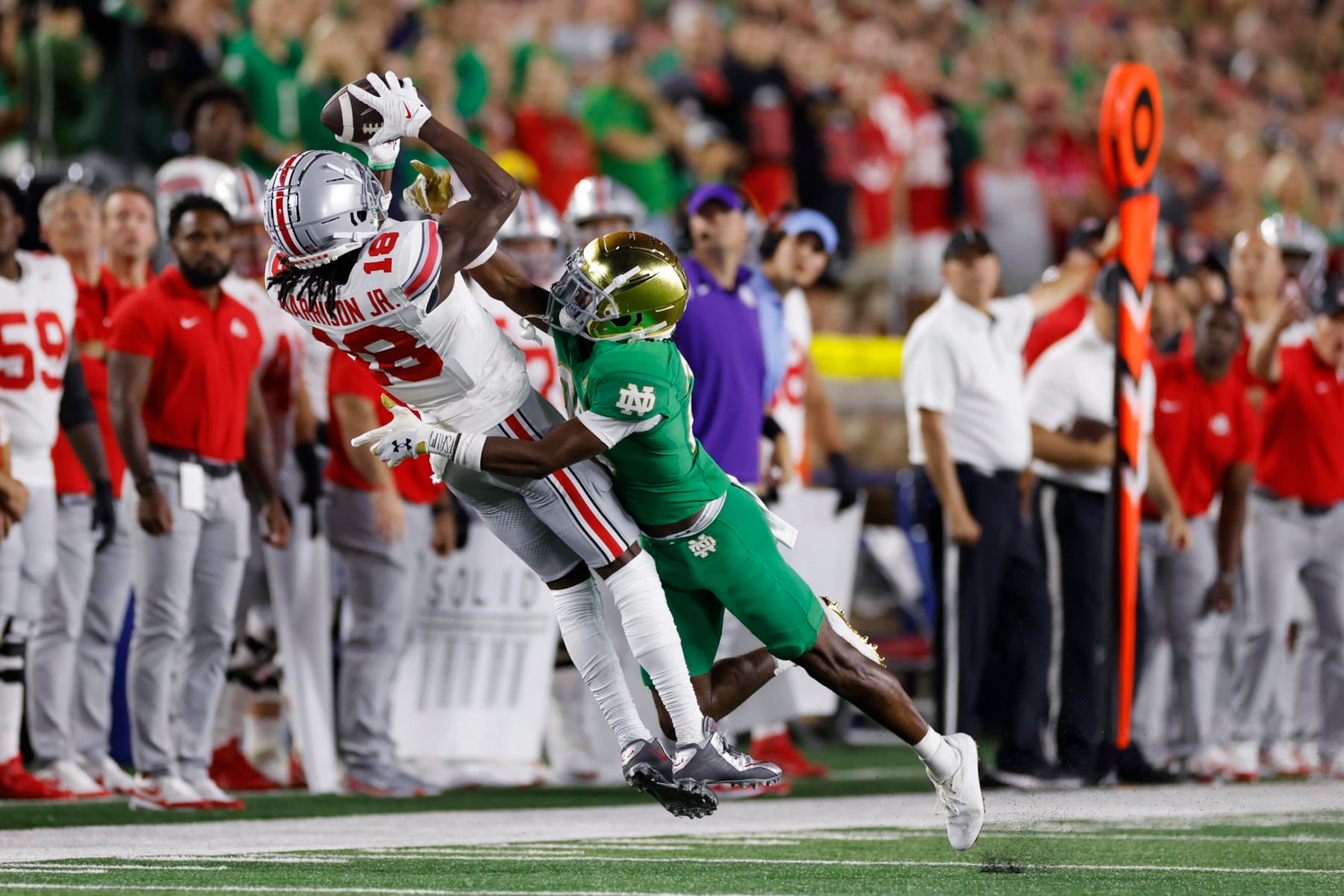 SOUTH BEND, IN - SEPTEMBER 23: Notre Dame Fighting Irish cornerback Benjamin Morrison (20) defends a pass against Ohio State Buckeyes wide receiver Marvin Harrison Jr. (18) during a college football game on September 23, 2023 at Notre Dame Stadium in South Bend, Indiana. (Photo by Joe Robbins/Icon Sportswire via Getty Images)