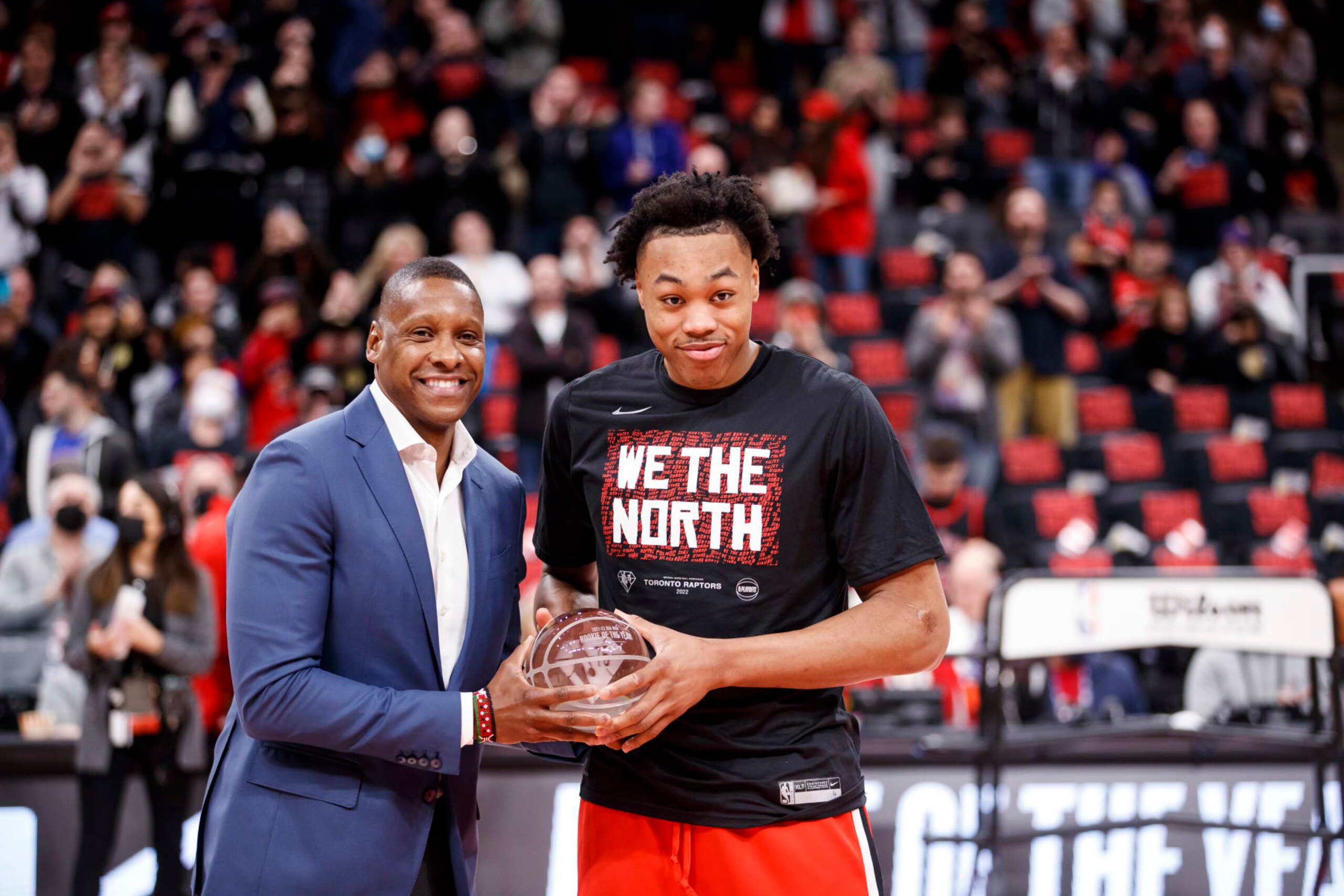 TORONTO, ON - APRIL 23: Scottie Barnes #4 of the Toronto Raptors is presented with the Rookie of the Year trophy from Raptors president Masai Ujiri ahead of Game Four of the Eastern Conference First Round against the Philadelphia 76ers at Scotiabank Arena on April 23, 2022 in Toronto, Canada. NOTE TO USER: User expressly acknowledges and agrees that, by downloading and or using this Photograph, user is consenting to the terms and conditions of the Getty Images License Agreement. (Photo by Cole Burston/Getty Images)
