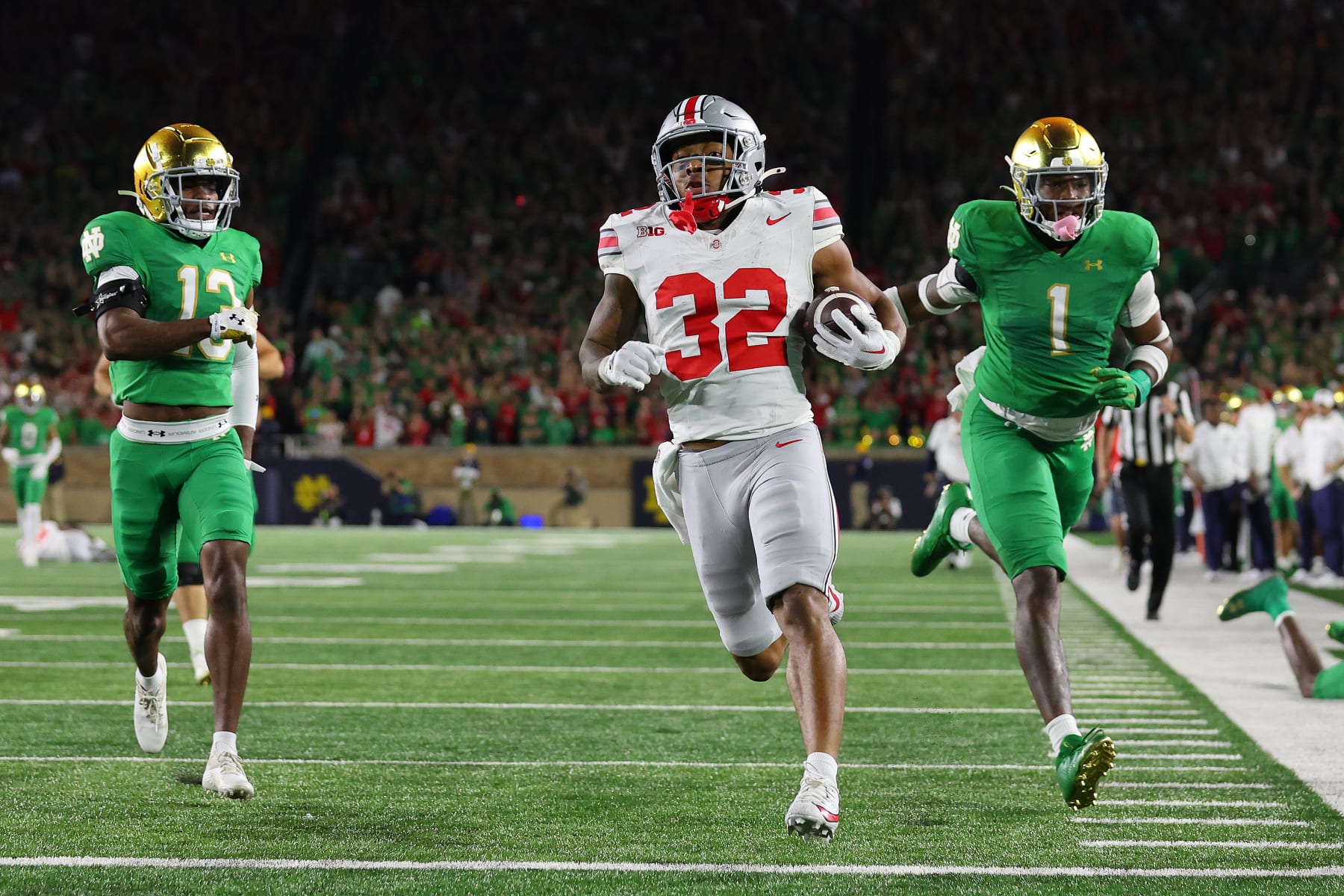 SOUTH BEND, INDIANA - SEPTEMBER 23: TreVeyon Henderson #32 of the Ohio State Buckeyes runs for a touchdown during the third quarter against the Notre Dame Fighting Irish at Notre Dame Stadium on September 23, 2023 in South Bend, Indiana. (Photo by Michael Reaves/Getty Images)