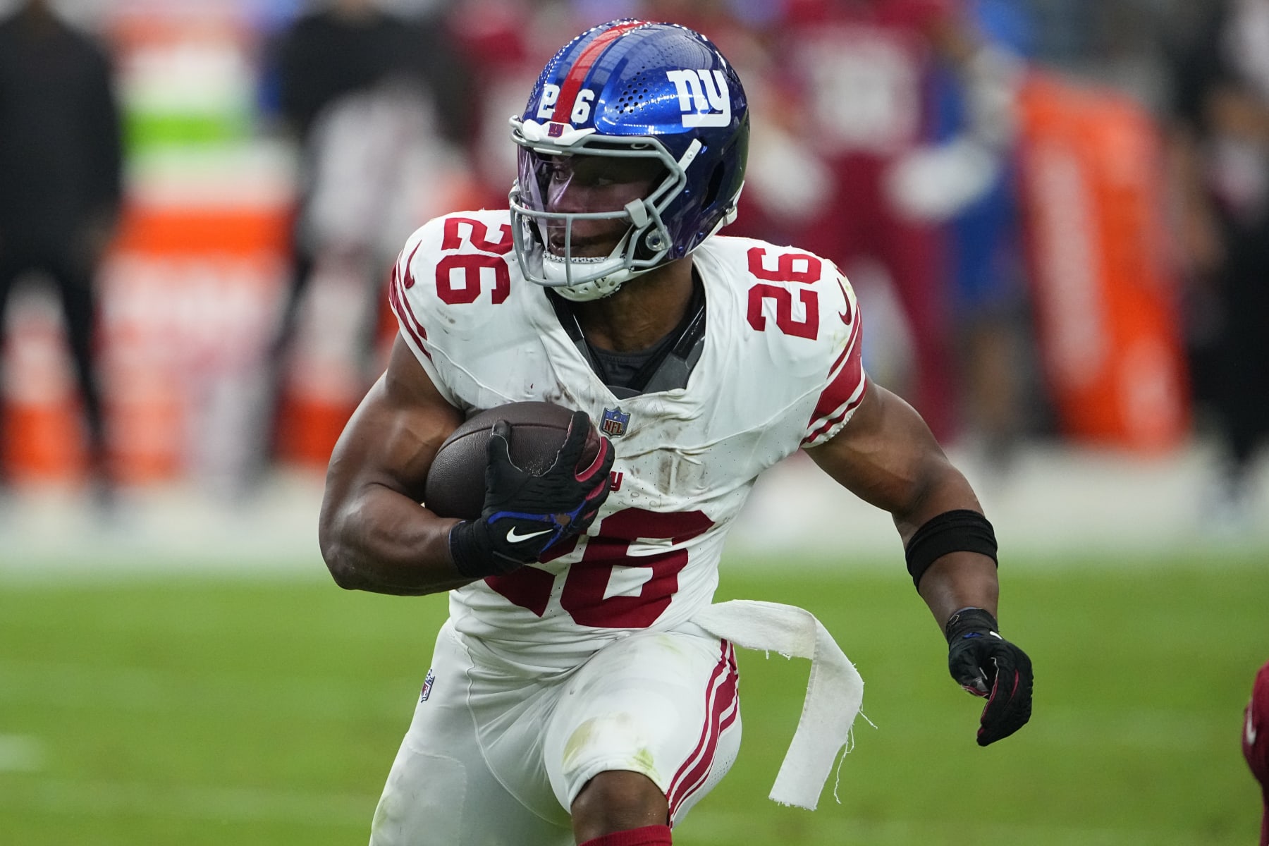 New York Giants running back Saquon Barkley (26) runs against the Arizona Cardinals during the second half of an NFL football game, Sunday, Sept. 17, 2023, in Glendale, Ariz. (AP Photo/Matt York)