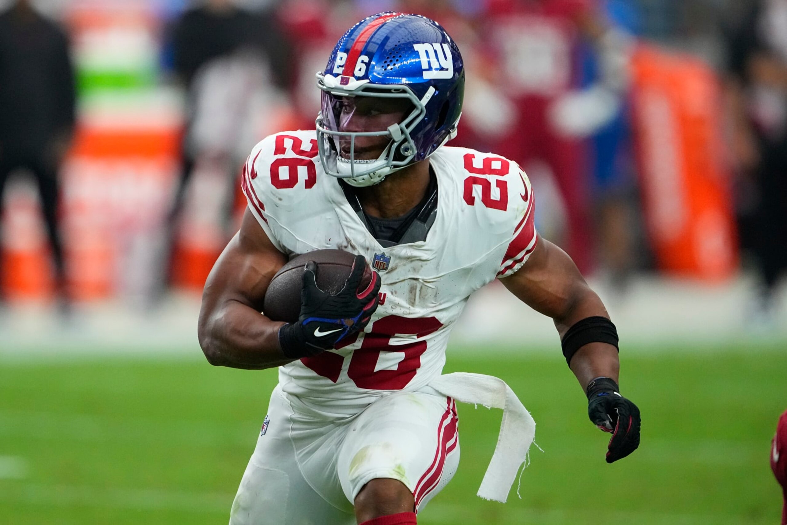 New York Giants running back Saquon Barkley (26) runs against the Arizona Cardinals during the second half of an NFL football game, Sunday, Sept. 17, 2023, in Glendale, Ariz. (AP Photo/Matt York)