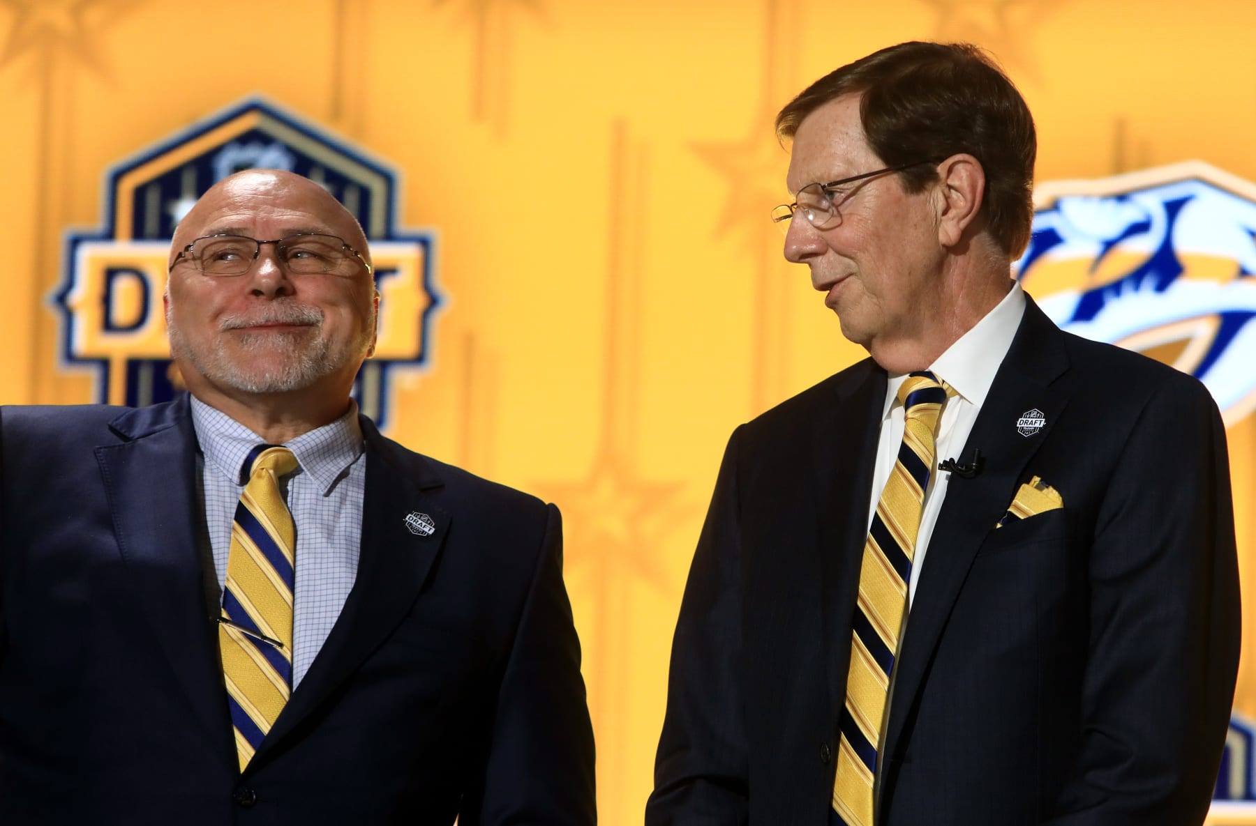 Predators GM Barry Trotz, left, with David Poile, who retired from the position.