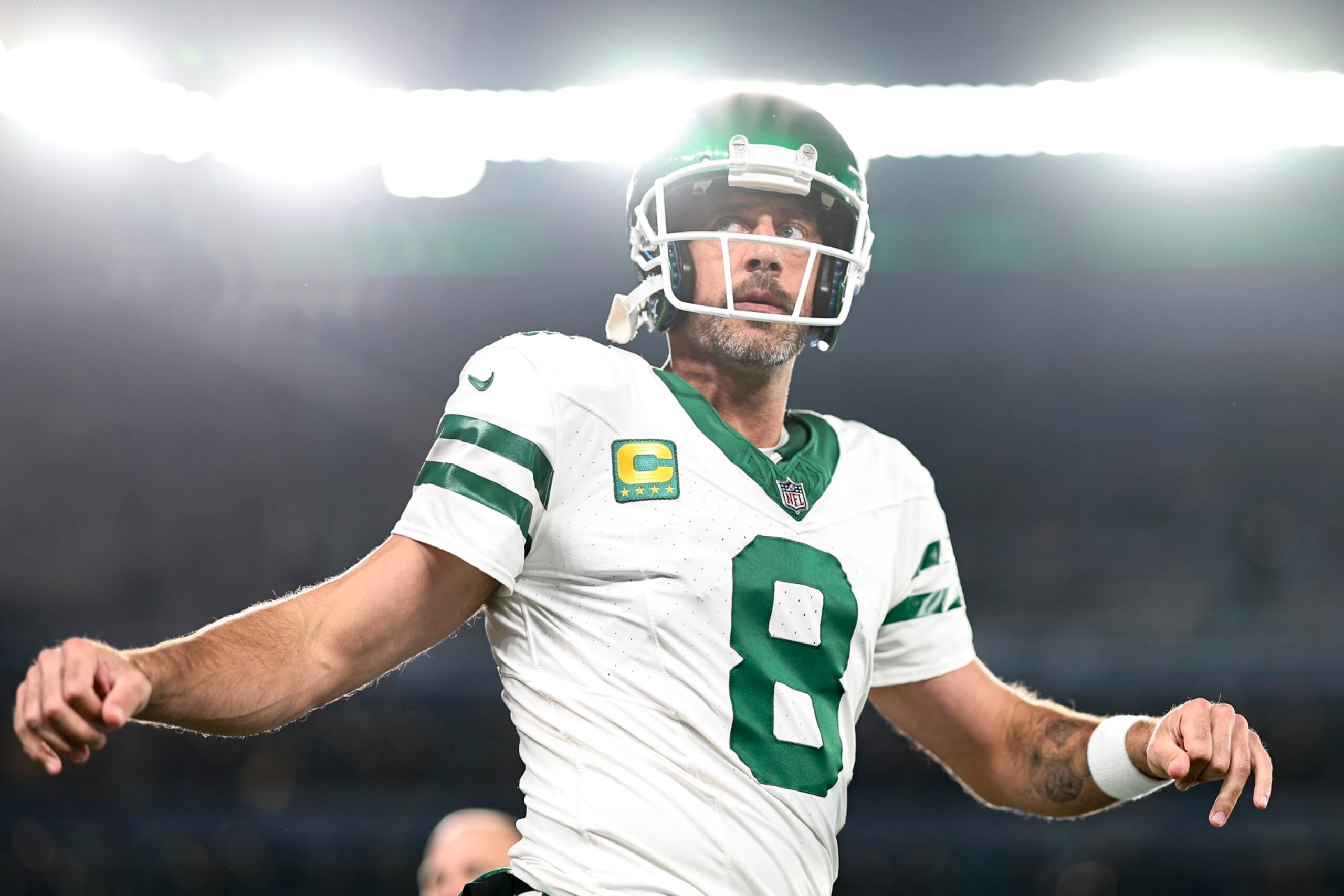 EAST RUTHERFORD, NEW JERSEY - SEPTEMBER 11: Aaron Rodgers #8 of the New York Jets stretches as he warms up prior to a game against the Buffalo Bills at MetLife Stadium on September 11, 2023 in East Rutherford, New Jersey. (Photo by Michael Owens/Getty Images)