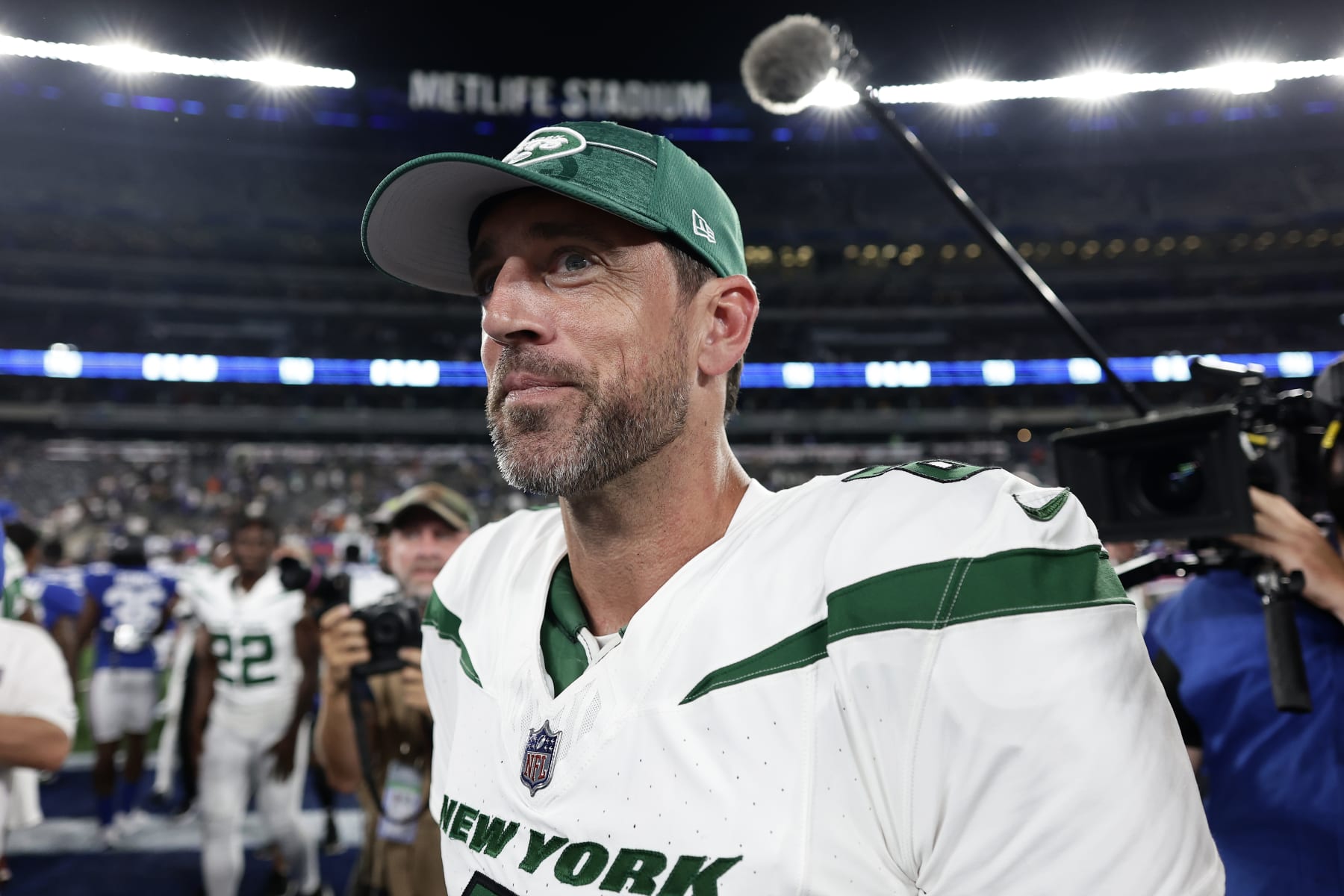 New York Jets quarterback Aaron Rodgers (8) walks off the field after an NFL preseason football game against the New York Giants, Saturday, Aug. 26, 2023, in East Rutherford, N.J. (AP Photo/Adam Hunger)