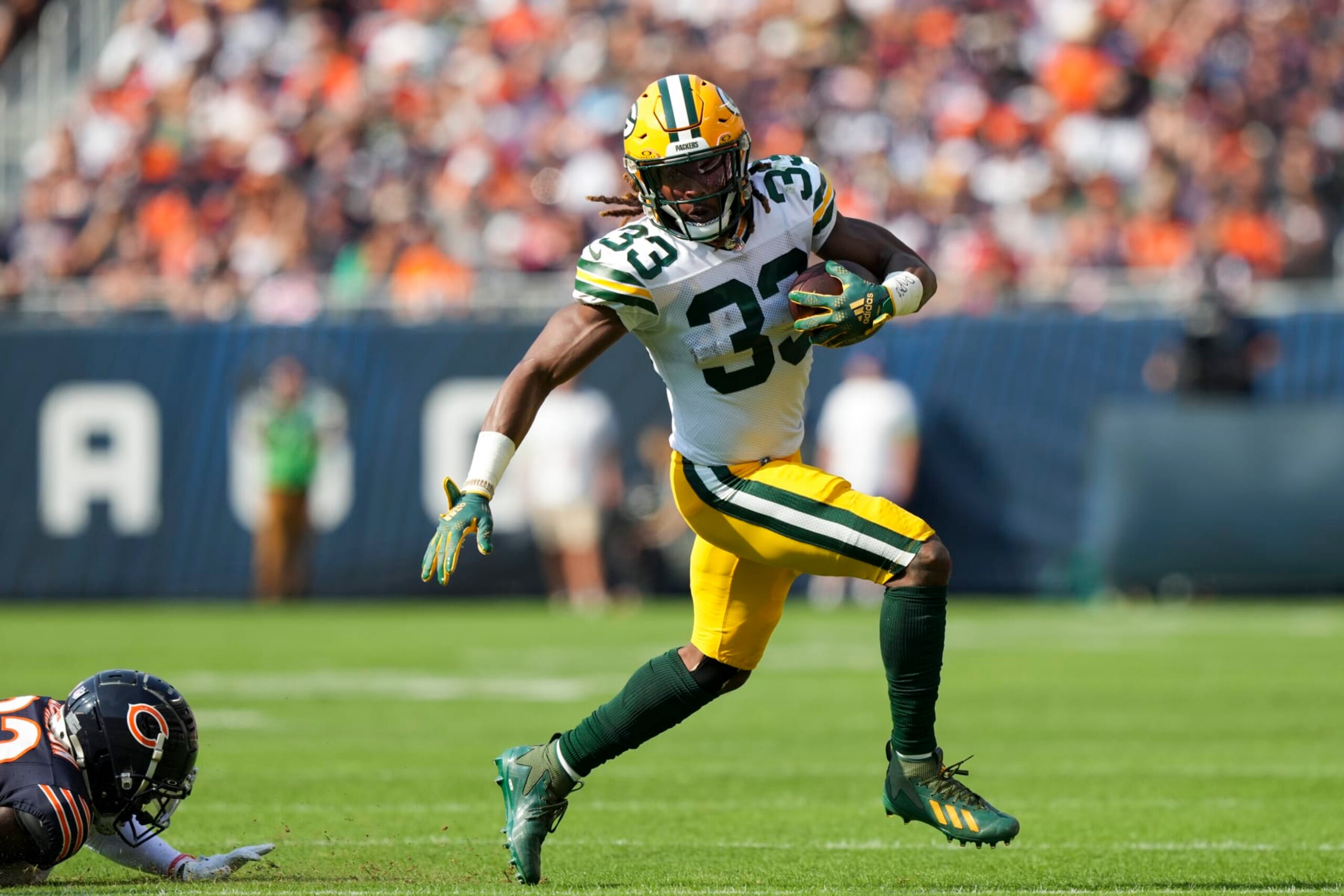 CHICAGO, IL - SEPTEMBER 10:  Running Back Aaron Jones #33 of the Green Bay Packers runs the ball during an NFL football game against the Chicago Bears at Soldier Field on September 10, 2023 in Chicago, Illinois. (Photo by Todd Rosenberg/Getty Images)