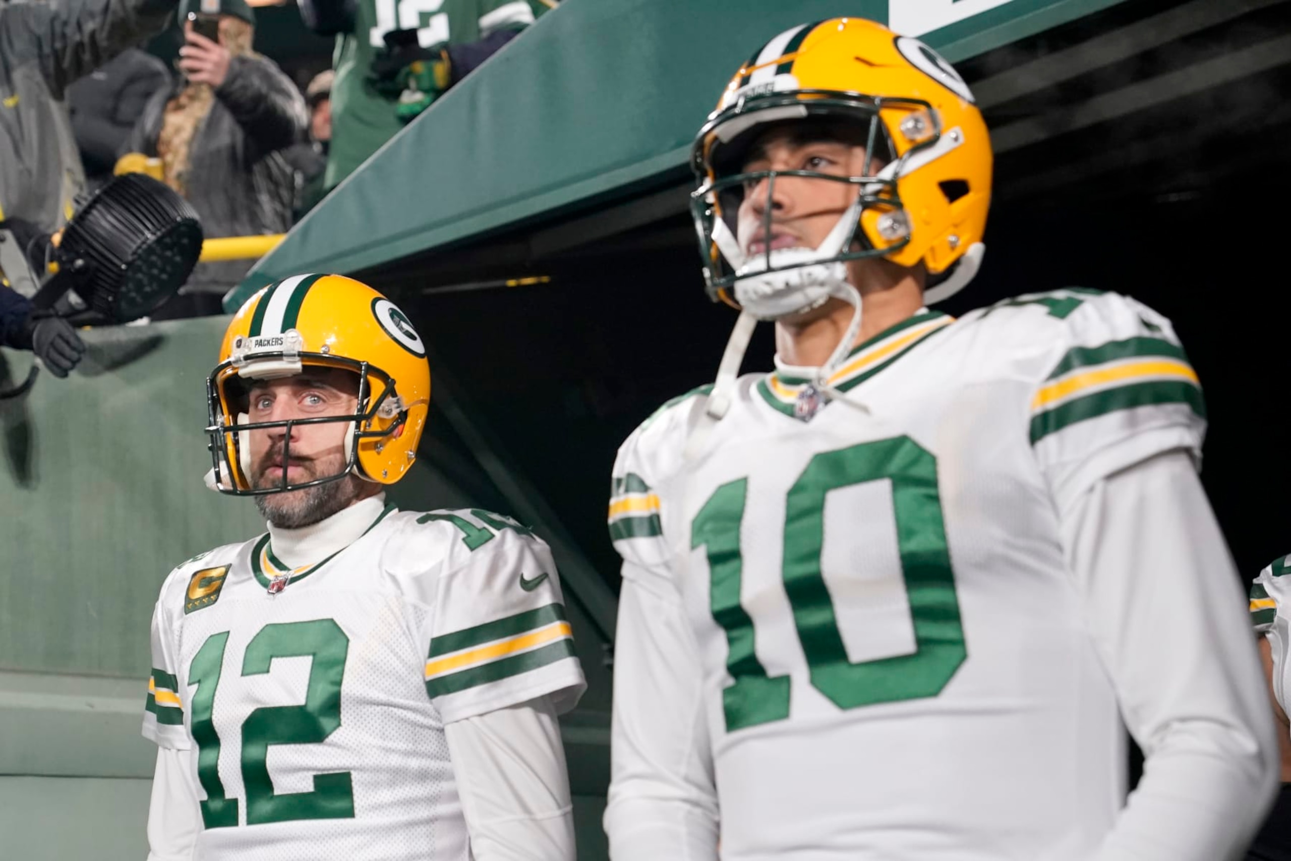 GREEN BAY, WISCONSIN - NOVEMBER 17: Aaron Rodgers #12 and Jordan Love #10 of the Green Bay Packers look on prior to the game against the Tennessee Titans at Lambeau Field on November 17, 2022 in Green Bay, Wisconsin. (Photo by Patrick McDermott/Getty Images)