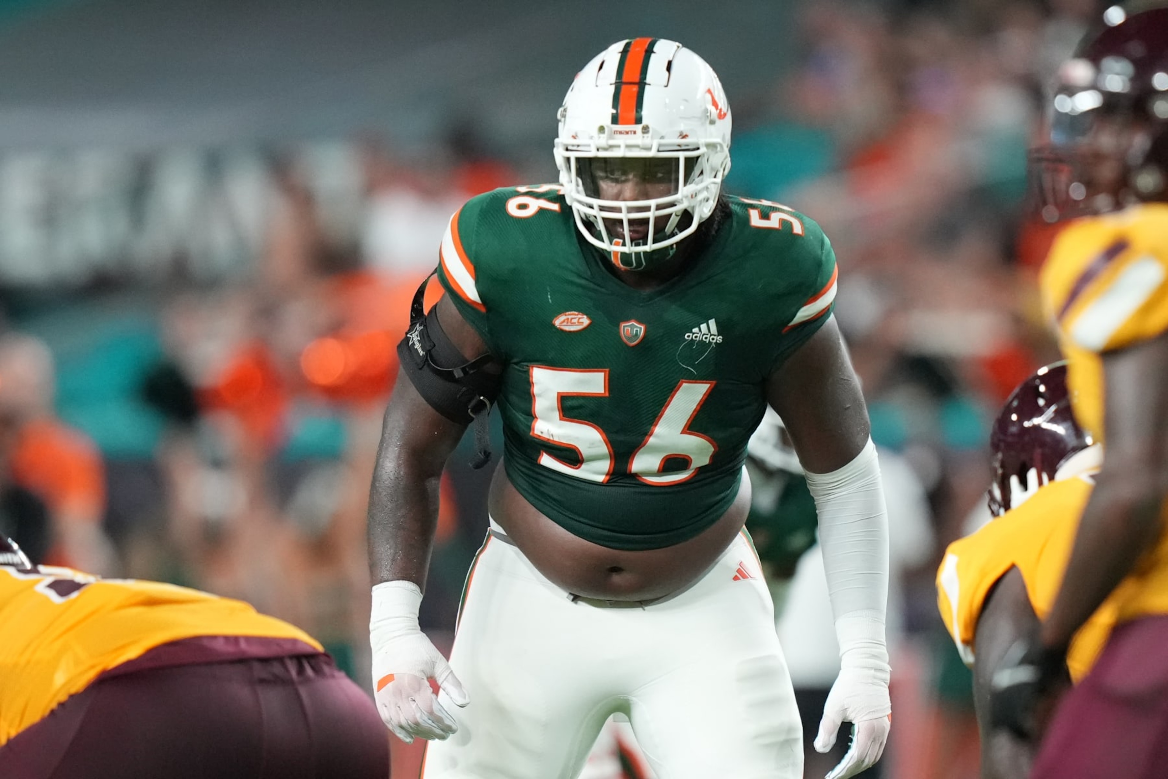 MIAMI GARDENS, FL - SEPTEMBER 14: Miami Hurricanes defensive lineman Leonard Taylor III (56) checks the backfield before a snap during the game between the Bethune-Cookman Wildcats and the Miami Hurricanes on Thursday, September 14, 2023 at Hard Rock Stadium, Miami Gardens, Fla. (Photo by Peter Joneleit/Icon Sportswire via Getty Images)