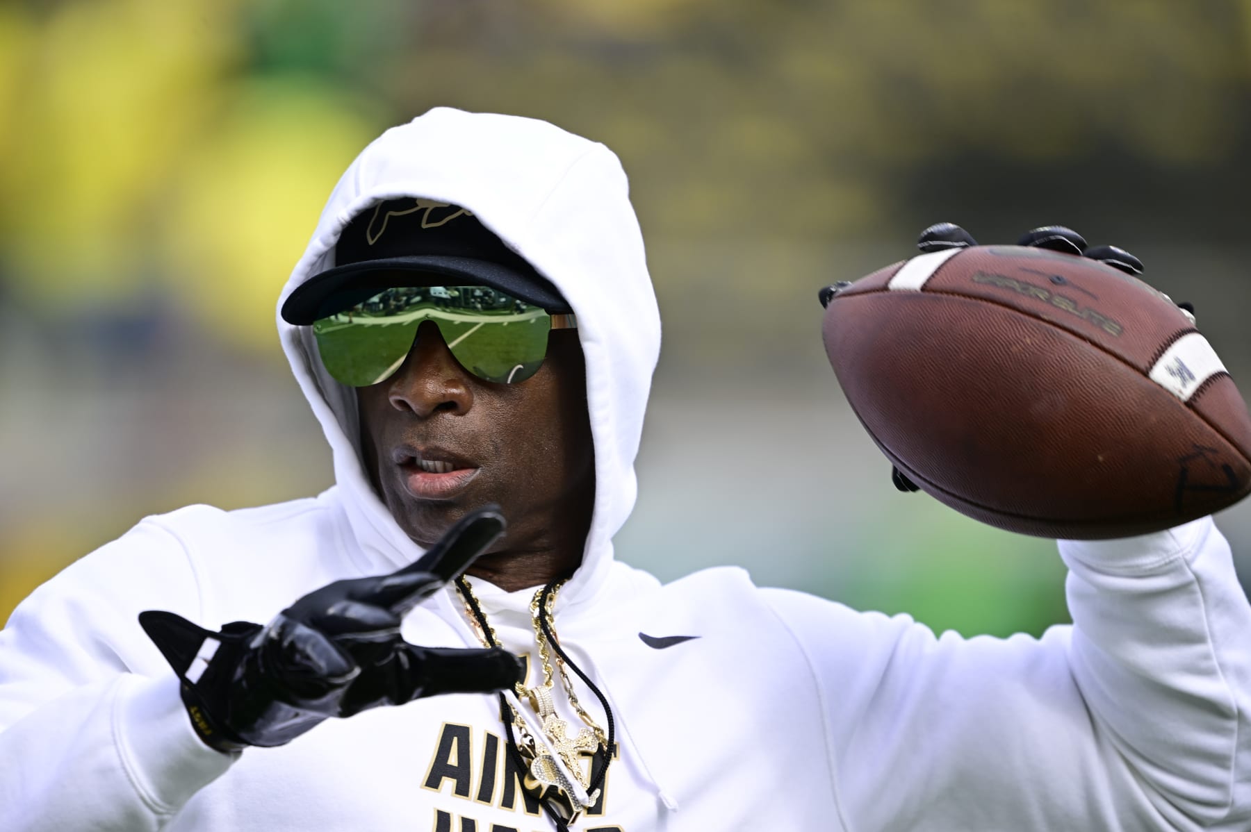 EUGENE, OR - SEPTEMBER 23: Colorado Buffaloes head coach Deion Sanders plays a little catch on the field just before warmups before playing the Oregon Ducks at Autzen Stadium September 23, 2023. (Photo by Andy Cross/MediaNews Group/The Denver Post via Getty Images) EUGENE, OR - SEPTEMBER 23: Colorado Buffaloes head coach Deion Sanders plays a little catch on the field just before warmups before playing the Oregon Ducks at Autzen Stadium September 23, 2023. (Photo by Andy Cross/MediaNews Group/The Denver Post via Getty Images)