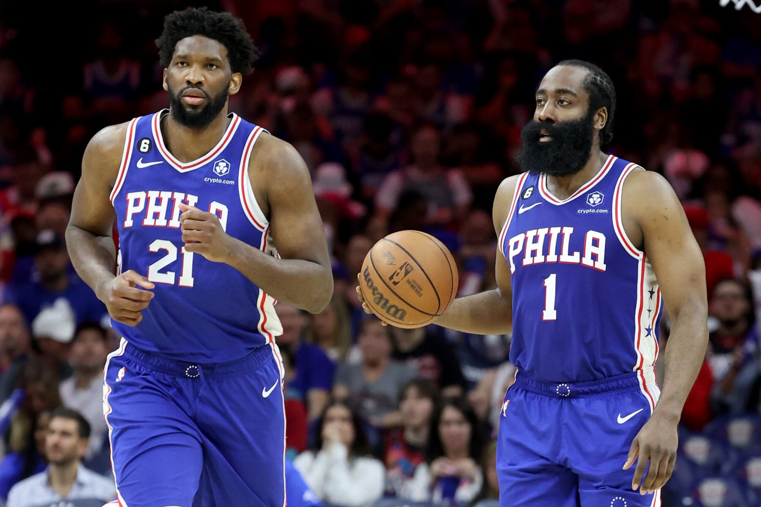 PHILADELPHIA, PENNSYLVANIA - MAY 11: Joel Embiid #21 and James Harden #1 of the Philadelphia 76ers talk against the Boston Celtics during the third quarter in game six of the Eastern Conference Semifinals in the 2023 NBA Playoffs at Wells Fargo Center on May 11, 2023 in Philadelphia, Pennsylvania. NOTE TO USER: User expressly acknowledges and agrees that, by downloading and or using this photograph, User is consenting to the terms and conditions of the Getty Images License Agreement. (Photo by Tim Nwachukwu/Getty Images)