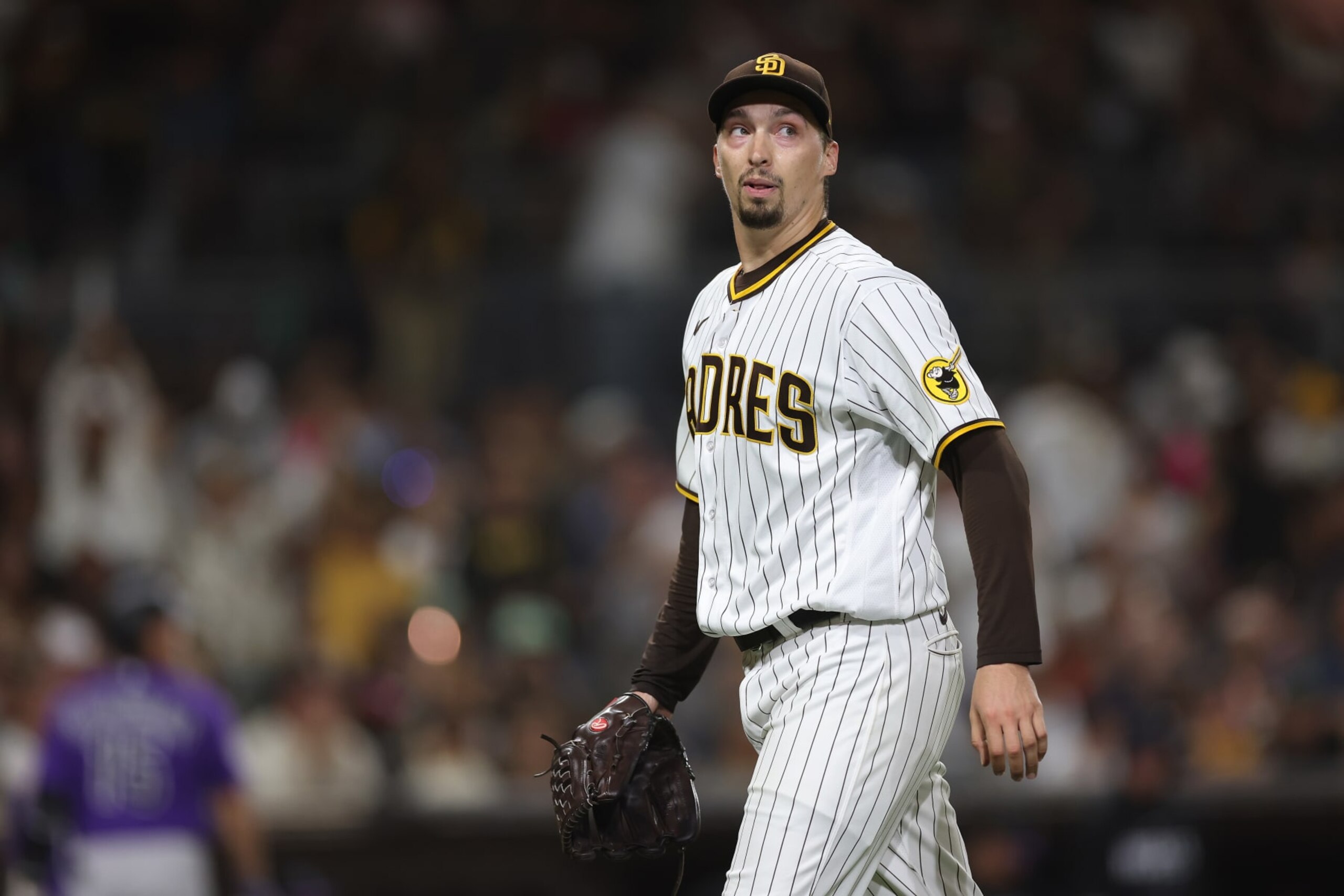SAN DIEGO, CALIFORNIA - SEPTEMBER 19: Blake Snell #4 of the San Diego Padres reacts as he walks to the dugout after throwing seven hitless innings a game against the Colorado Rockies at PETCO Park on September 19, 2023 in San Diego, California. (Photo by Sean M. Haffey/Getty Images) SAN DIEGO, CALIFORNIA - SEPTEMBER 19: Blake Snell #4 of the San Diego Padres reacts as he walks to the dugout after throwing seven hitless innings a game against the Colorado Rockies at PETCO Park on September 19, 2023 in San Diego, California. (Photo by Sean M. Haffey/Getty Images)