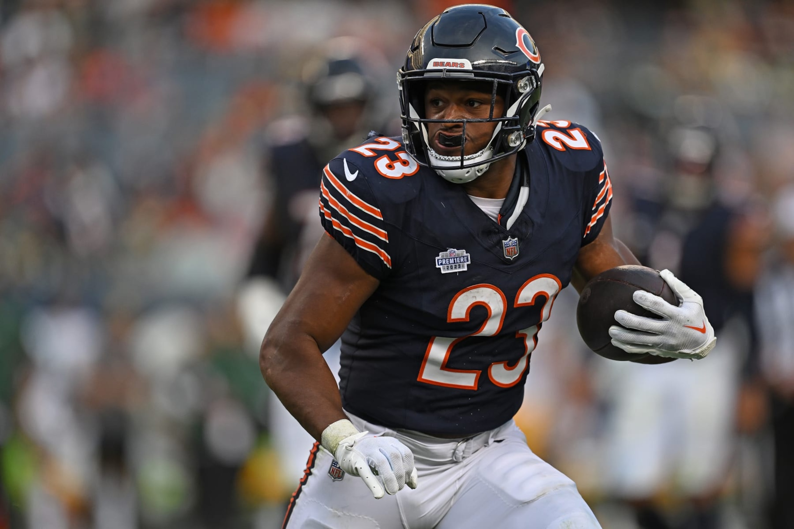 CHICAGO, ILLINOIS - SEPTEMBER 10:  Roschon Johnson #23 of the Chicago Bears carries the ball against the Green Bay Packers during the second half at Soldier Field on September 10, 2023 in Chicago, Illinois. (Photo by Quinn Harris/Getty Images)