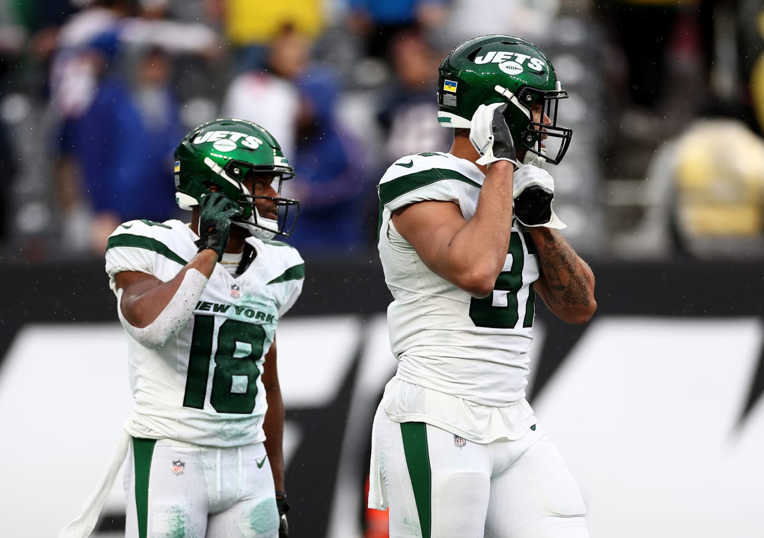 EAST RUTHERFORD, NEW JERSEY - SEPTEMBER 24: C.J. Uzomah #87 and Randall Cobb #18 of the New York Jets react to the loss to the New England Patriots at MetLife Stadium on September 24, 2023 in East Rutherford, New Jersey. (Photo by Elsa/Getty Images)