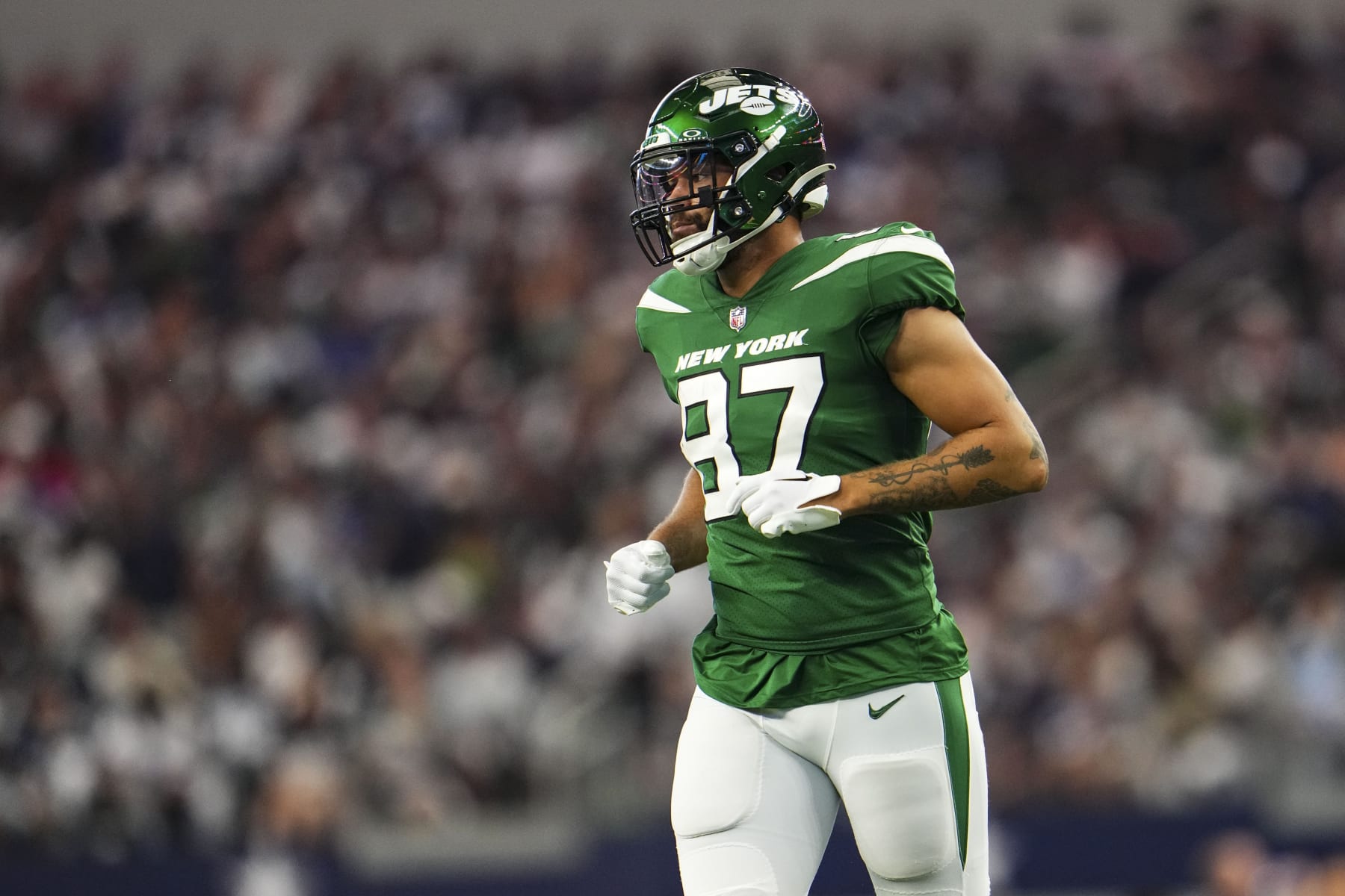 ARLINGTON, TX - SEPTEMBER 17: C.J. Uzomah #87 of the New York Jets runs across the field during a football game at AT&T Stadium on September 17, 2023 in Arlington, Texas. (Photo by Cooper Neill/Getty Images)