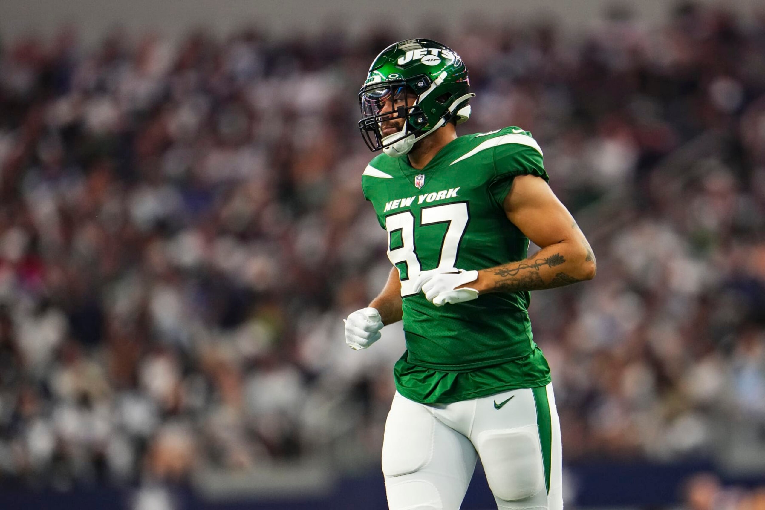 ARLINGTON, TX - SEPTEMBER 17: C.J. Uzomah #87 of the New York Jets runs across the field during a football game at AT&T Stadium on September 17, 2023 in Arlington, Texas. (Photo by Cooper Neill/Getty Images)