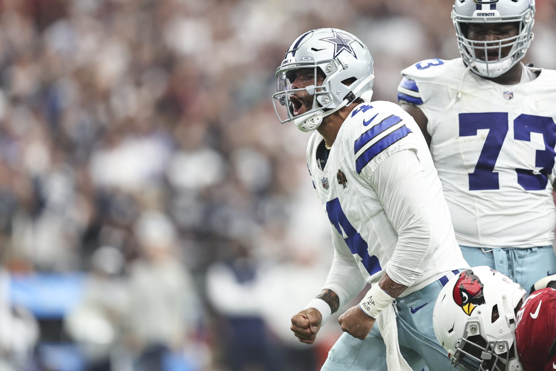 GLENDALE, ARIZONA - SEPTEMBER 24: Dak Prescott #4 of the Dallas Cowboys celebrates after scrambling and running with the ball during an NFL football game between the Arizona Cardinals and the Dallas Cowboys at State Farm Stadium on September 24, 2023 in Glendale, Arizona. (Photo by Michael Owens/Getty Images)