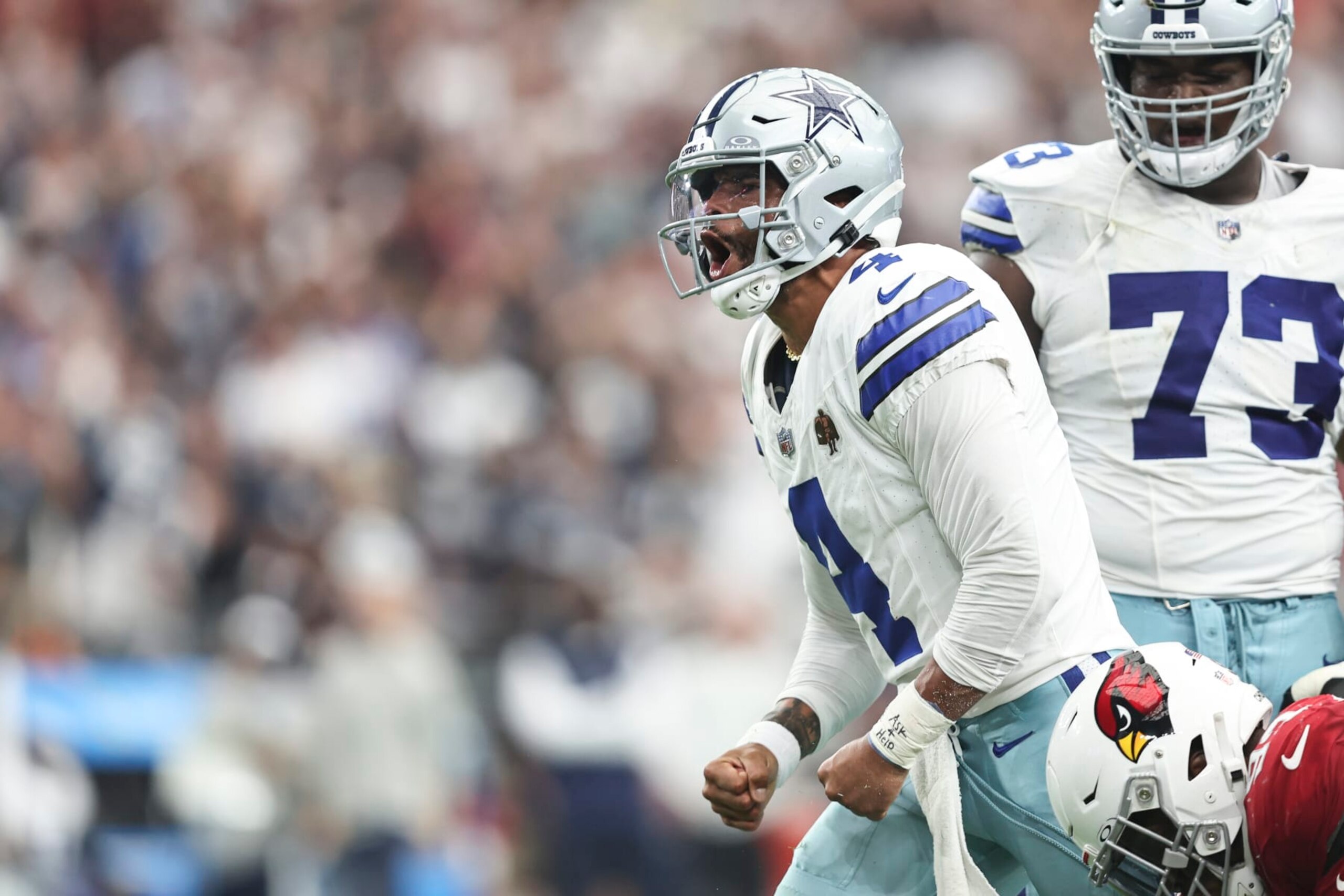 GLENDALE, ARIZONA - SEPTEMBER 24: Dak Prescott #4 of the Dallas Cowboys celebrates after scrambling and running with the ball during an NFL football game between the Arizona Cardinals and the Dallas Cowboys at State Farm Stadium on September 24, 2023 in Glendale, Arizona. (Photo by Michael Owens/Getty Images) GLENDALE, ARIZONA - SEPTEMBER 24: Dak Prescott #4 of the Dallas Cowboys celebrates after scrambling and running with the ball during an NFL football game between the Arizona Cardinals and the Dallas Cowboys at State Farm Stadium on September 24, 2023 in Glendale, Arizona. (Photo by Michael Owens/Getty Images)