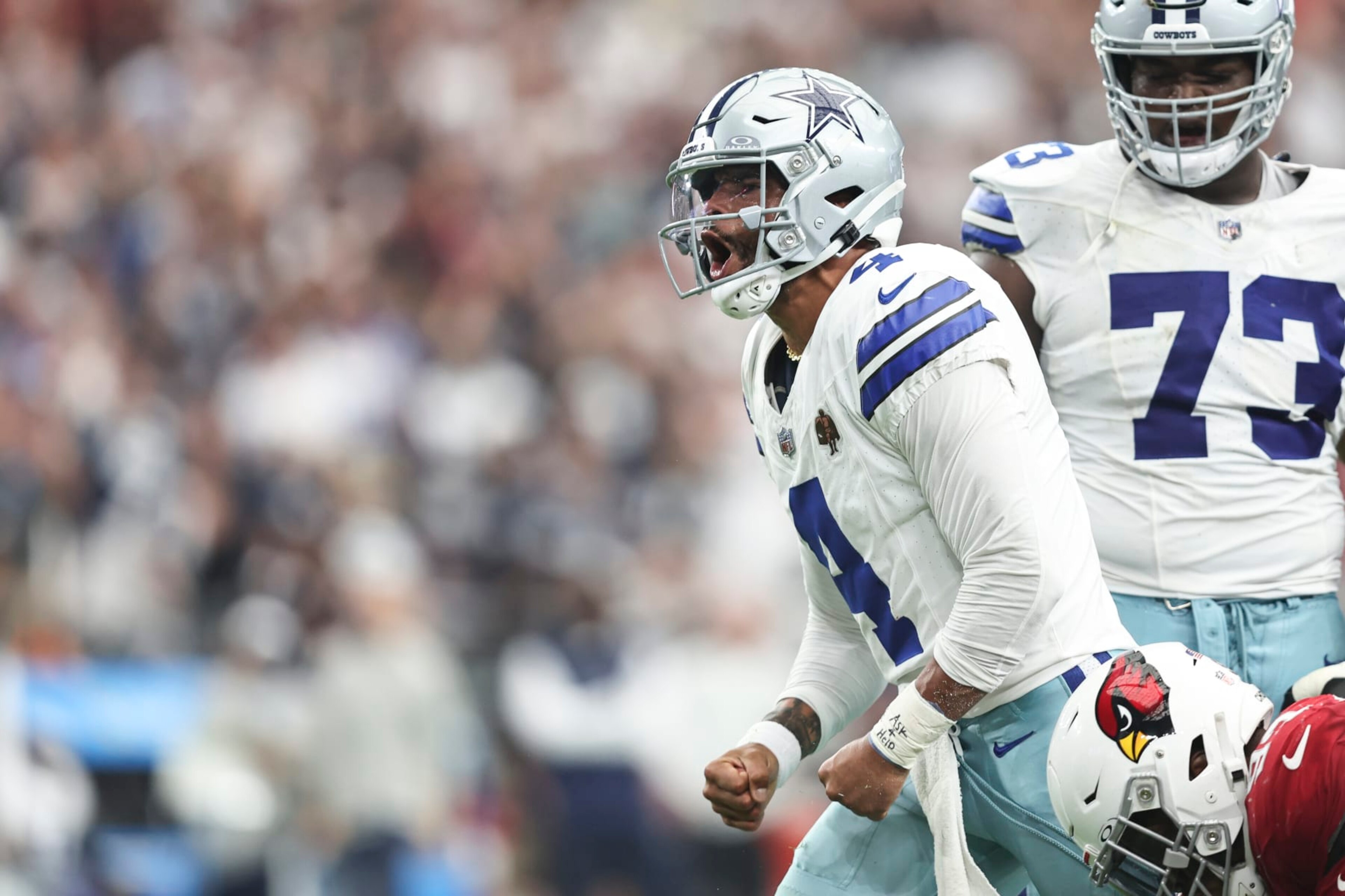 GLENDALE, ARIZONA - SEPTEMBER 24: Dak Prescott #4 of the Dallas Cowboys celebrates after scrambling and running with the ball during an NFL football game between the Arizona Cardinals and the Dallas Cowboys at State Farm Stadium on September 24, 2023 in Glendale, Arizona. (Photo by Michael Owens/Getty Images)