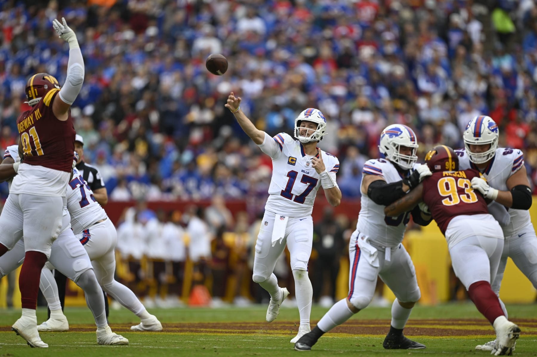 LANDOVER, MD - SEPTEMBER 24: Buffalo Bills quarterback Josh Allen (17) throws a touchdown  pass during the first quarter of the game against the Washington Commanders at FedEx Field on September 24, 2023. (Photo by John McDonnell/The Washington Post via Getty Images)