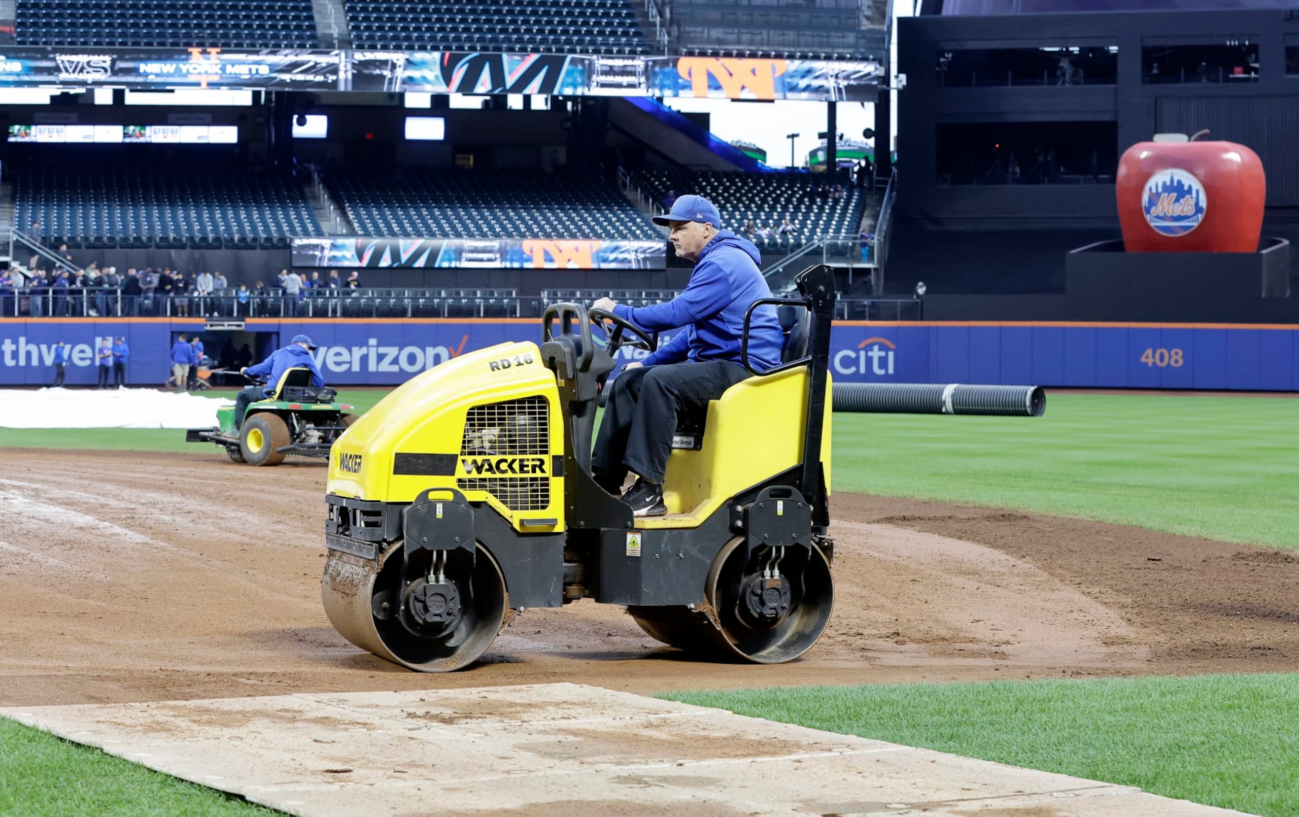 NEW YORK, NEW YORK - SEPTEMBER 26:  The grounds crew work on the field delaying a start of a game between the New York Mets and the Miami Marlins at Citi Field on September 26, 2023 in New York City. (Photo by Jim McIsaac/Getty Images)
