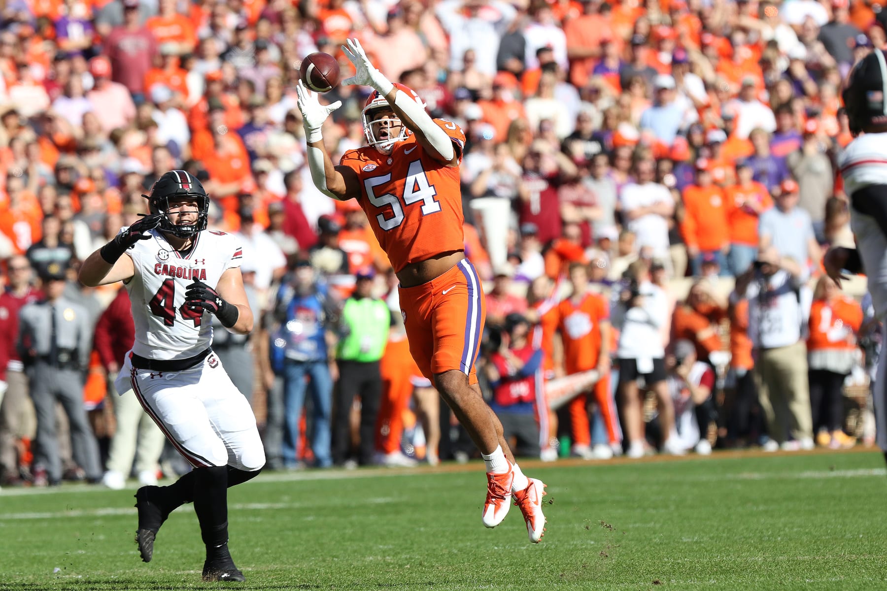 CLEMSON, SC - NOVEMBER 26: Clemson Tigers linebacker Jeremiah Trotter Jr. (54) catches an interception that he would run back for a touch down during a college football game between the South Carolina Gamecocks and the Clemson Tigers on November 26, 2022, at Clemson Memorial Stadium in Clemson, S.C. (Photo by John Byrum/Icon Sportswire via Getty Images)