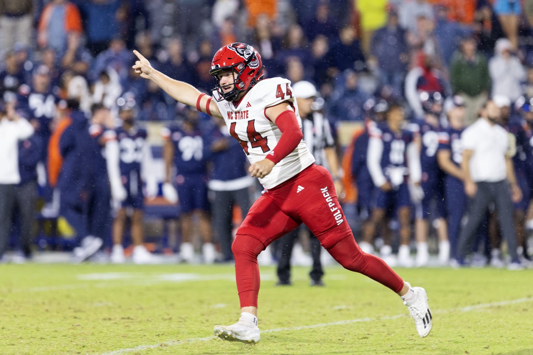CHARLOTTESVILLE, VIRGINIA - SEPTEMBER 22: Brayden Narveson #44 of the NC State Wolfpack celebrates after kicking the game-winning field goal in the second half during a game against the Virginia Cavaliers at Scott Stadium on September 22, 2023 in Charlottesville, Virginia. (Photo by Ryan M. Kelly/Getty Images)