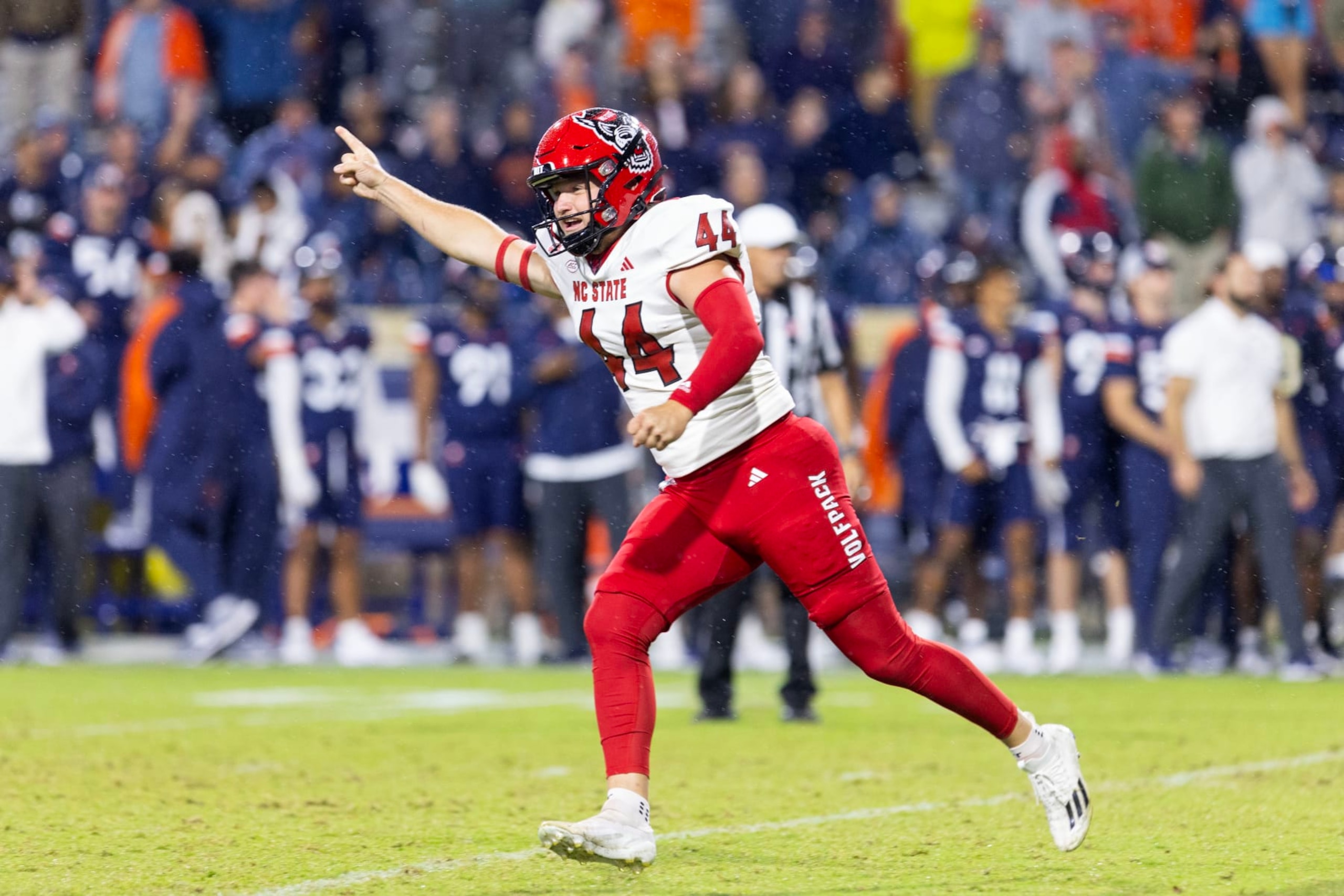 CHARLOTTESVILLE, VIRGINIA - SEPTEMBER 22: Brayden Narveson #44 of the NC State Wolfpack celebrates after kicking the game-winning field goal in the second half during a game against the Virginia Cavaliers at Scott Stadium on September 22, 2023 in Charlottesville, Virginia. (Photo by Ryan M. Kelly/Getty Images)