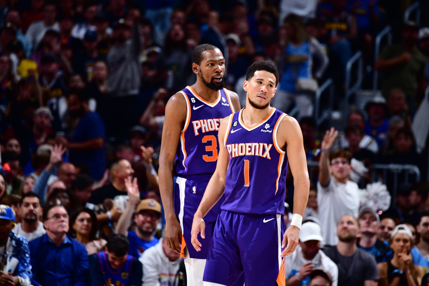 DENVER, CO - MAY 9: Kevin Durant #35 of the Phoenix Suns and Devin Booker #1 look on during Game Five of the Western Conference Semi-Finals of the 2023 NBA Playoffs against the Denver Nuggets on May 9, 2023 at the Ball Arena in Denver, Colorado. NOTE TO USER: User expressly acknowledges and agrees that, by downloading and/or using this Photograph, user is consenting to the terms and conditions of the Getty Images License Agreement. Mandatory Copyright Notice: Copyright 2023 NBAE (Photo by Barry Gossage/NBAE via Getty Images)