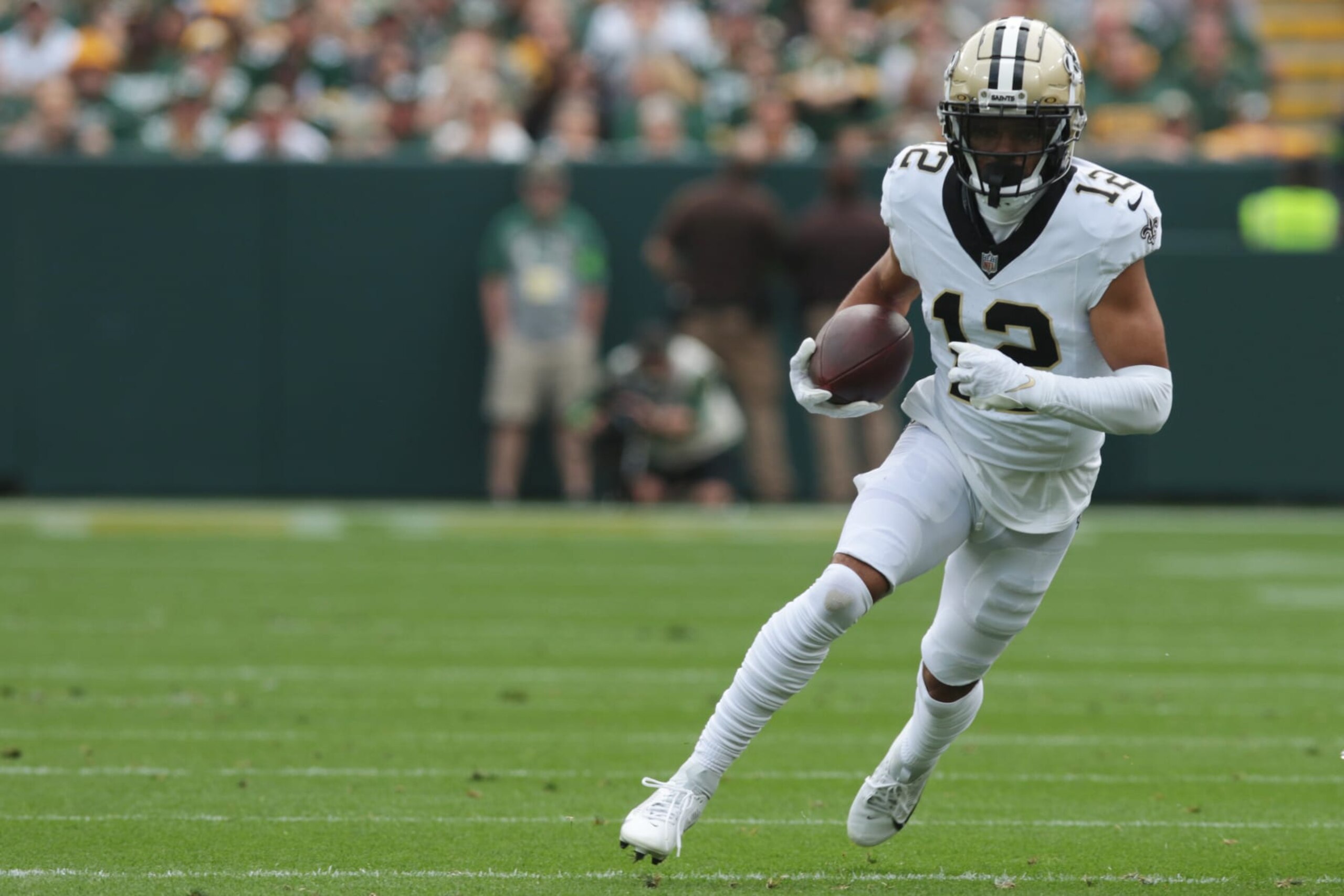 GREEN BAY, WI - SEPTEMBER 24: New Orleans Saints wide receiver Chris Olave (12) runs with the ball during a game between the Green Bay Packers and the New Orleans Saints on September 24, 2023 at Lambeau Field in Green Bay, WI. (Photo by Larry Radloff/Icon Sportswire via Getty Images)