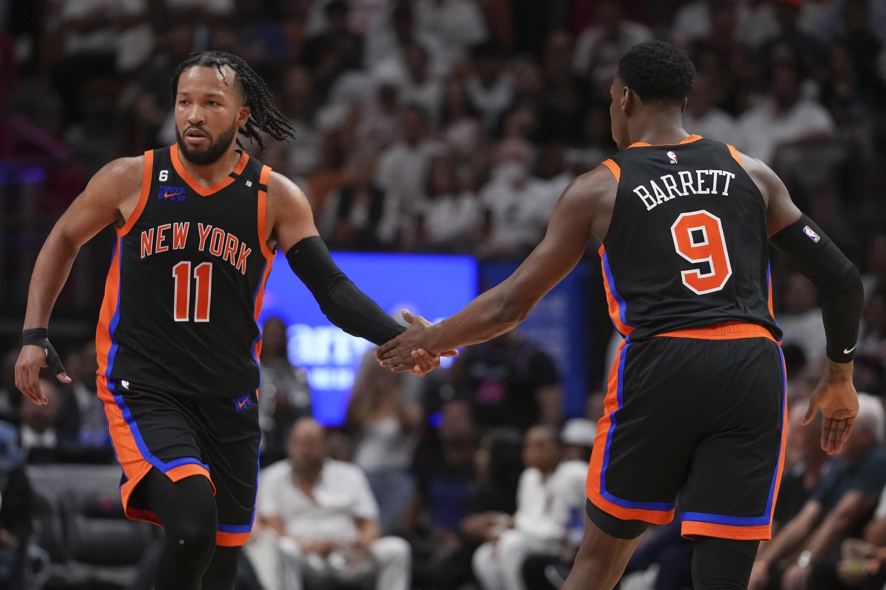 MIAMI, FLORIDA - MAY 08: RJ Barrett #9 of the New York Knicks congratulates teammate Jalen Brunson #11 during Game Four of the Eastern Conference Semifinals against the Miami Heat at Kaseya Center on May 08, 2023 in Miami, Florida. The Heat won the game 109-101. NOTE TO USER: User expressly acknowledges and agrees that,  by downloading and or using this photograph,  User is consenting to the terms and conditions of the Getty Images License Agreement. (Photo by Eric Espada/Getty Images)