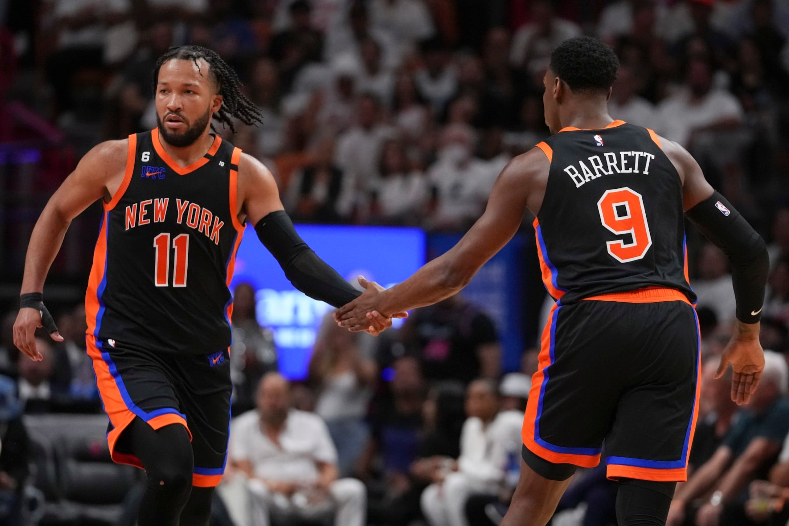 MIAMI, FLORIDA - MAY 08: RJ Barrett #9 of the New York Knicks congratulates teammate Jalen Brunson #11 during Game Four of the Eastern Conference Semifinals against the Miami Heat at Kaseya Center on May 08, 2023 in Miami, Florida. The Heat won the game 109-101. NOTE TO USER: User expressly acknowledges and agrees that,  by downloading and or using this photograph,  User is consenting to the terms and conditions of the Getty Images License Agreement. (Photo by Eric Espada/Getty Images)