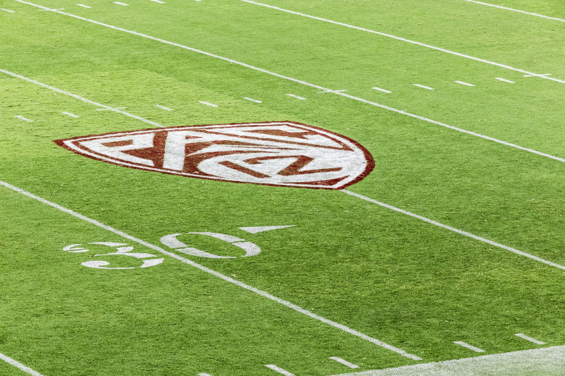 PALO ALTO, CA - SEPTEMBER 16:  A view of the Pac-12 logo on the field at Stanford Stadium during an NCAA college football game between the Stanford Cardinal and the Sacramento State Hornets played on September 16, 2023 in Palo Alto, California.  (Photo by David Madison/Getty Images)