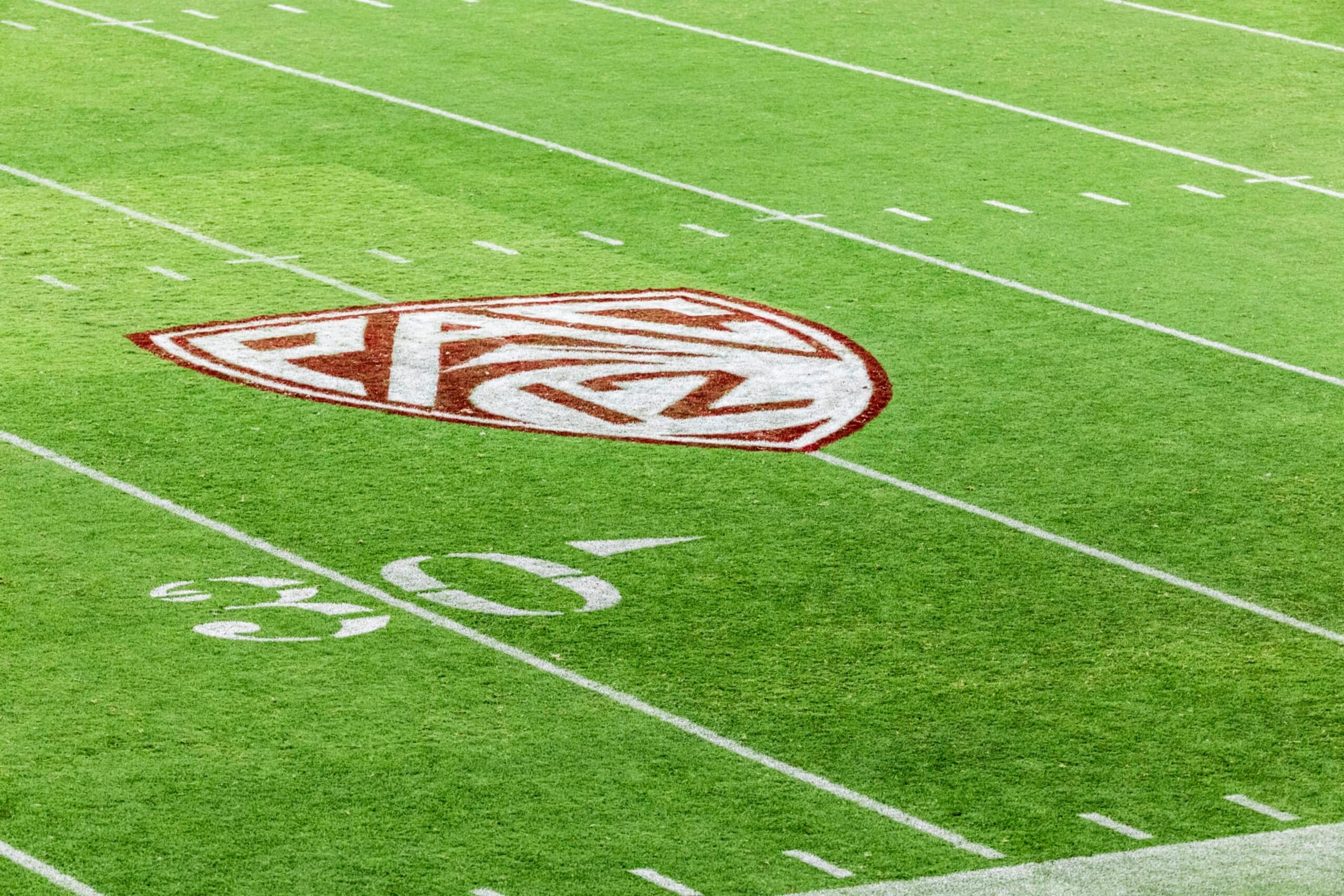 PALO ALTO, CA - SEPTEMBER 16:  A view of the Pac-12 logo on the field at Stanford Stadium during an NCAA college football game between the Stanford Cardinal and the Sacramento State Hornets played on September 16, 2023 in Palo Alto, California.  (Photo by David Madison/Getty Images)