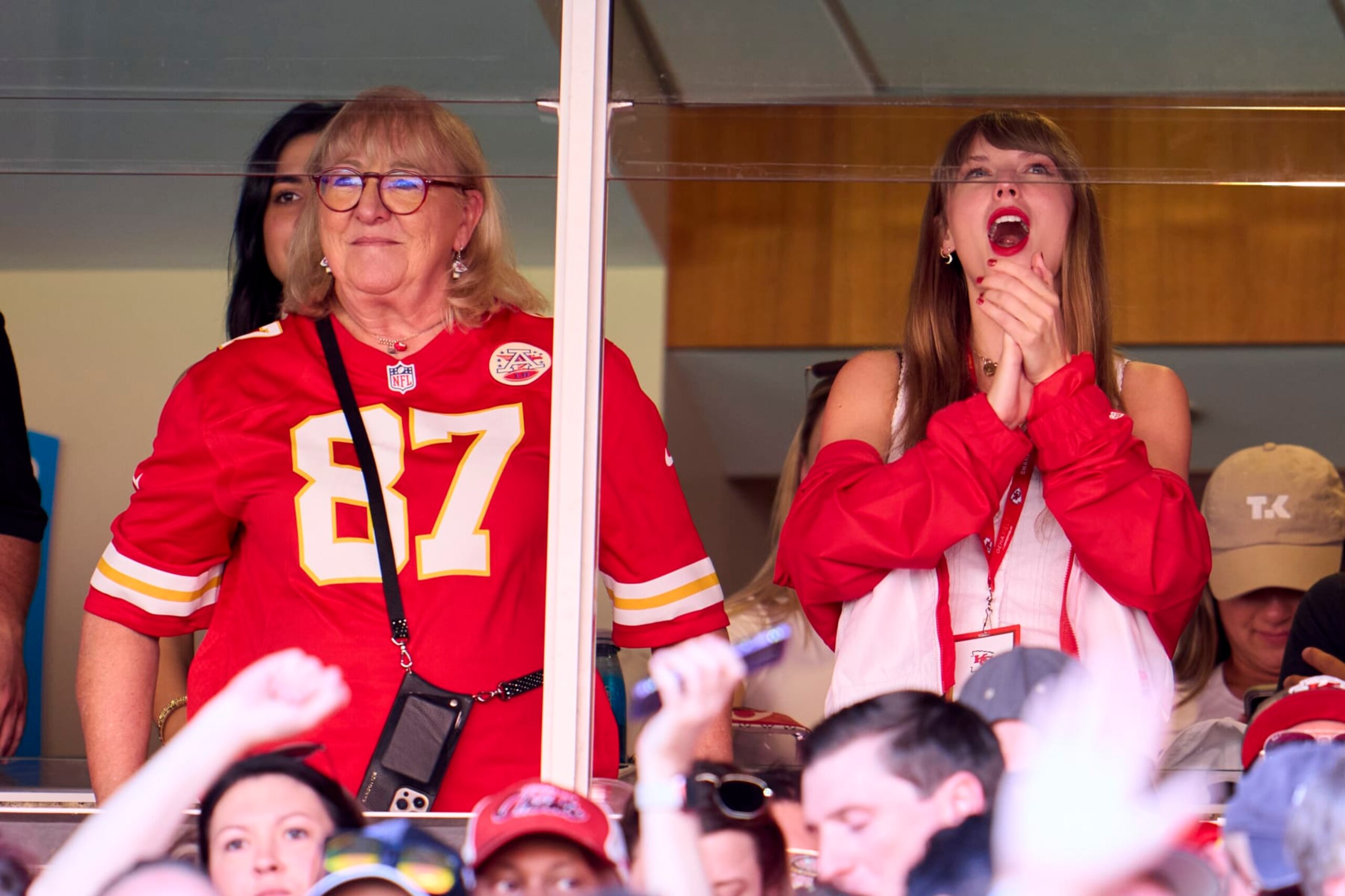 KANSAS CITY, MO - SEPTEMBER 24: Taylor Swift cheers from a suite with Donna Kelce as the Kansas City Chiefs play the Chicago Bears during the first half at GEHA Field at Arrowhead Stadium on September 24, 2023 in Kansas City, Missouri. (Photo by Cooper Neill/Getty Images)