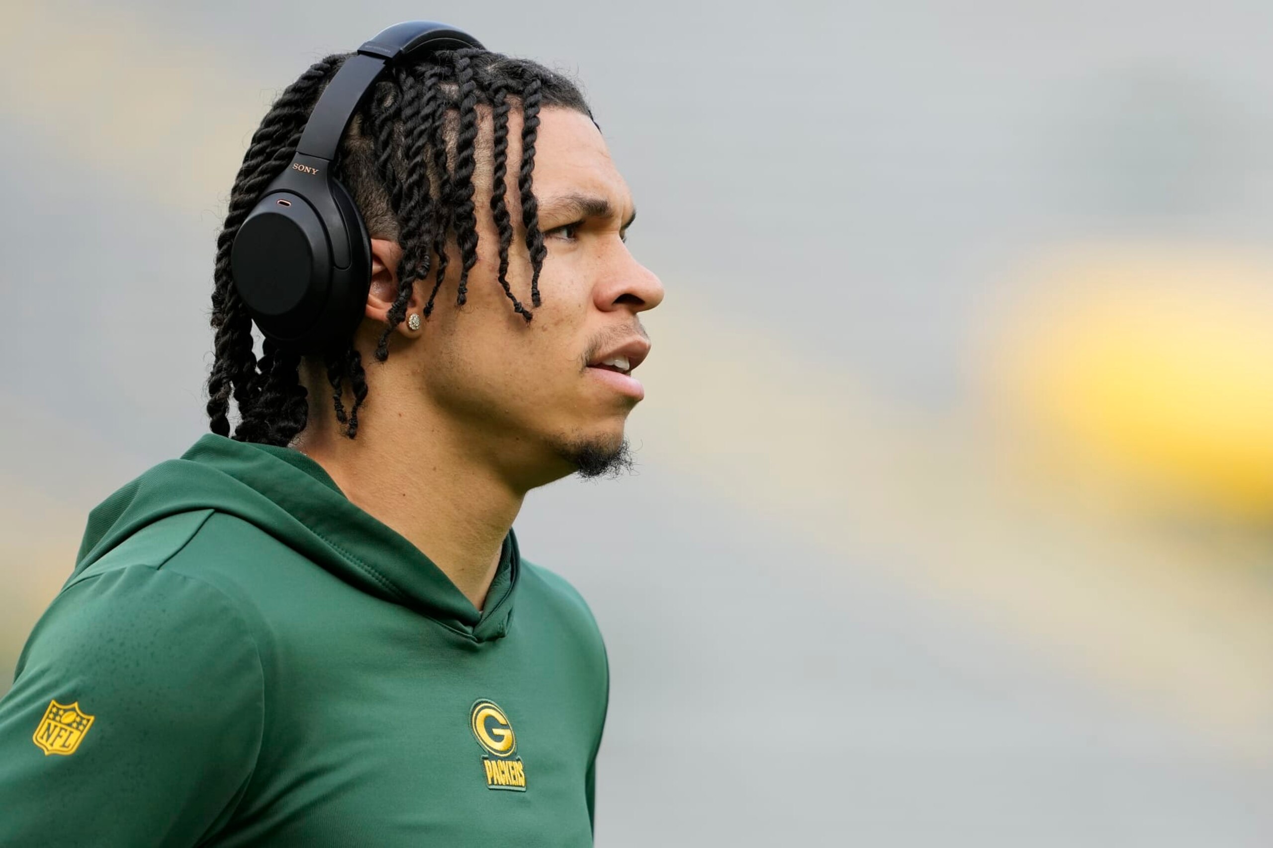 GREEN BAY, WISCONSIN - SEPTEMBER 24: Christian Watson #9 of the Green Bay Packers looks on before a game against the New Orleans Saints at Lambeau Field on September 24, 2023 in Green Bay, Wisconsin. (Photo by Patrick McDermott/Getty Images)