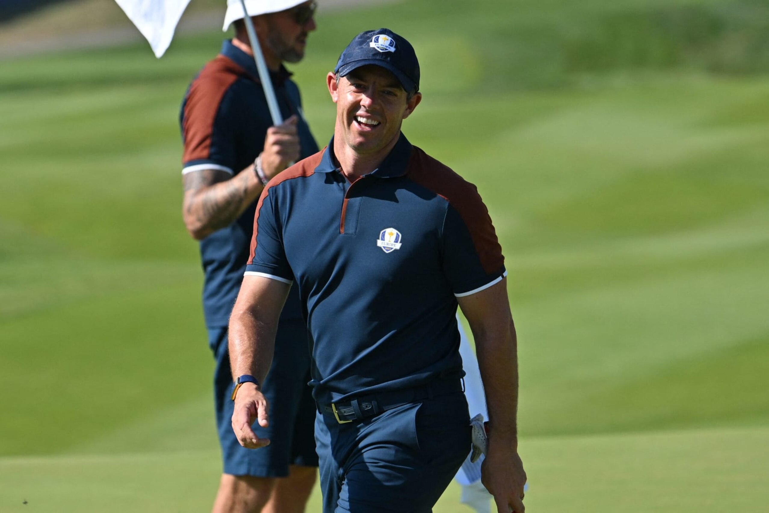 Europe's Northern Irish golfer, Rory McIlroy smiles on the 1st green during practice ahead of the 44th Ryder Cup at the Marco Simone Golf and Country Club in Rome on September 28, 2023. (Photo by Alberto PIZZOLI / AFP) (Photo by ALBERTO PIZZOLI/AFP via Getty Images)