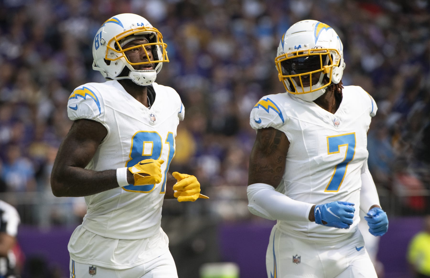 MINNEAPOLIS, MINNESOTA - SEPTEMBER 24: Mike Williams #81 of the Los Angeles Chargers and Gerald Everett #7 line up for a play in the first quarter of the game against the Minnesota Vikings at U.S. Bank Stadium on September 24, 2023 in Minneapolis, Minnesota. (Photo by Stephen Maturen/Getty Images)