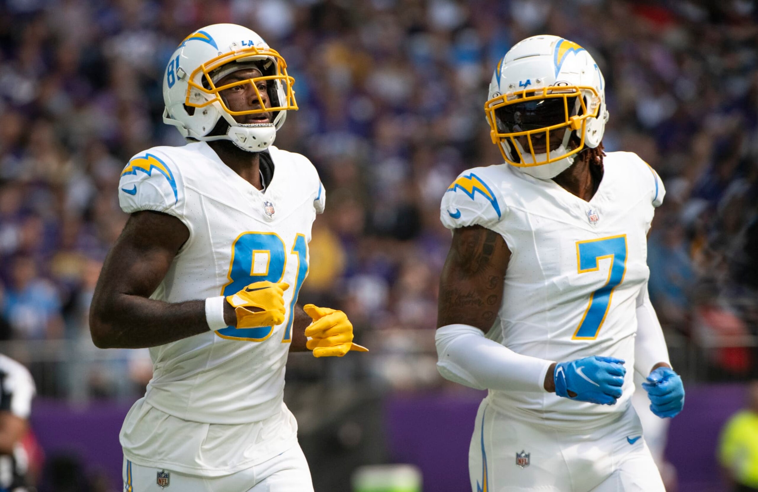 MINNEAPOLIS, MINNESOTA - SEPTEMBER 24: Mike Williams #81 of the Los Angeles Chargers and Gerald Everett #7 line up for a play in the first quarter of the game against the Minnesota Vikings at U.S. Bank Stadium on September 24, 2023 in Minneapolis, Minnesota. (Photo by Stephen Maturen/Getty Images)