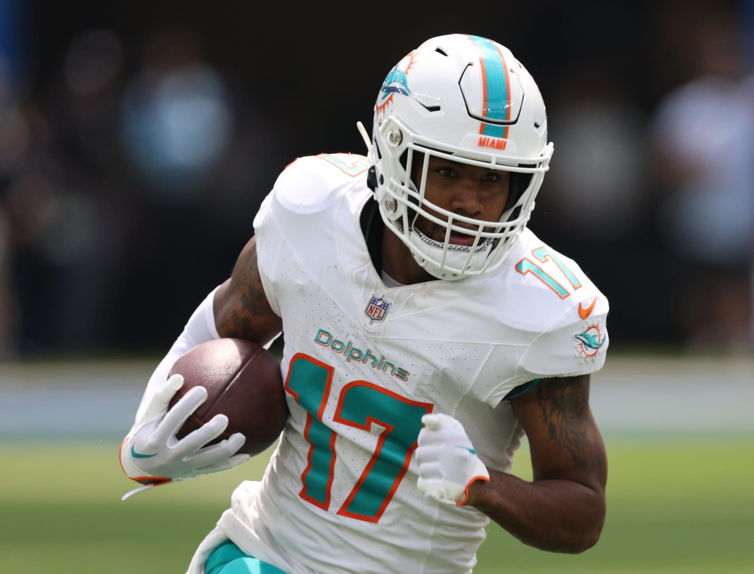 INGLEWOOD, CALIFORNIA - SEPTEMBER 10: Jaylen Waddle #17 of the Miami Dolphins runs after his catch during a 36-34 Dolphins win over the Los Angeles Chargers at SoFi Stadium on September 10, 2023 in Inglewood, California. (Photo by Harry How/Getty Images)