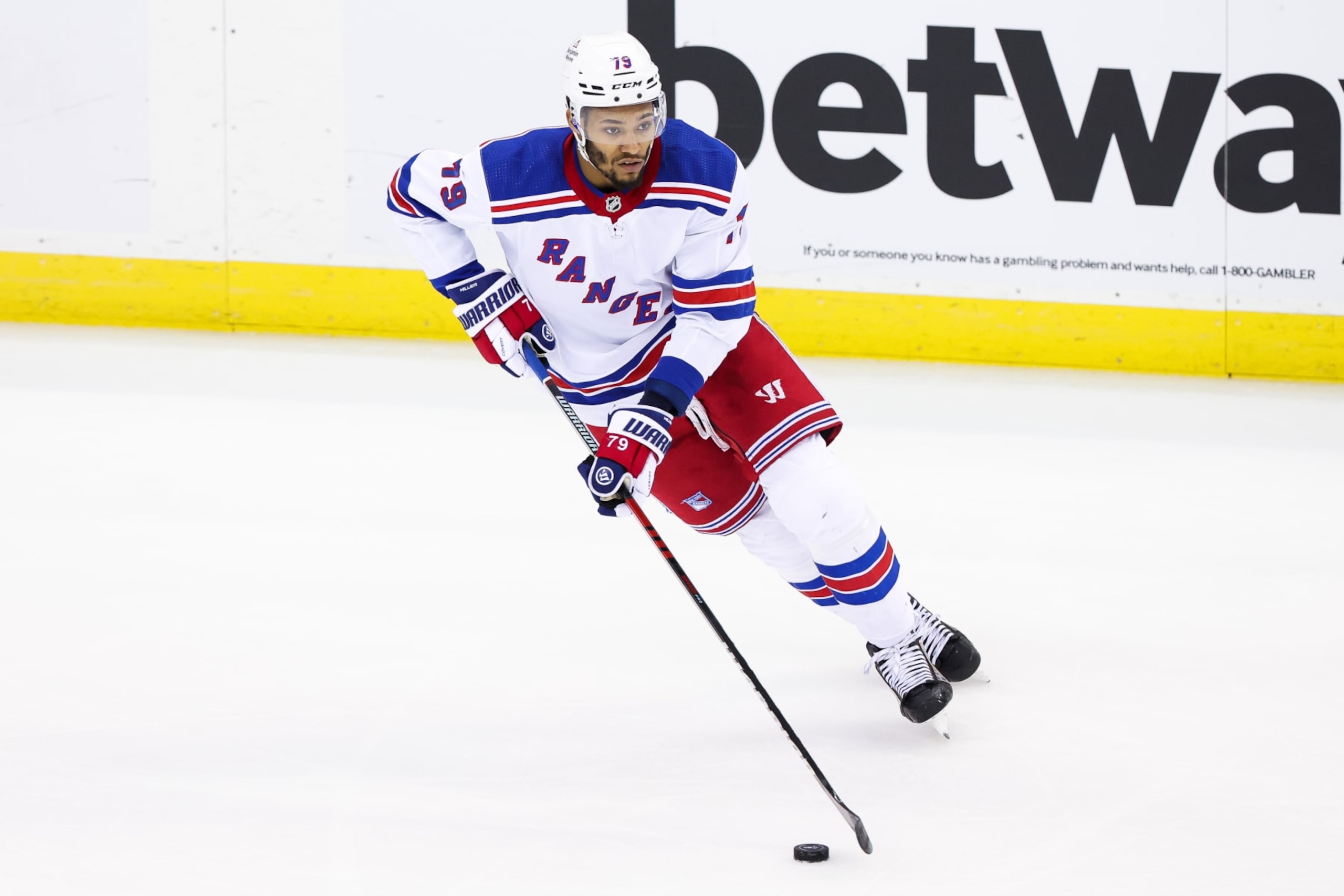 NEWARK, NJ - MAY 01: New York Rangers defenseman K'Andre Miller (79) skates with the puck during Game 7 of an Eastern Conference First Round playoff game between the New York Rangers and the New Jersey Devils on May 1, 2023, at Prudential Center in Newark, New Jersey. (Photo by Andrew Mordzynski/Icon Sportswire via Getty Images)