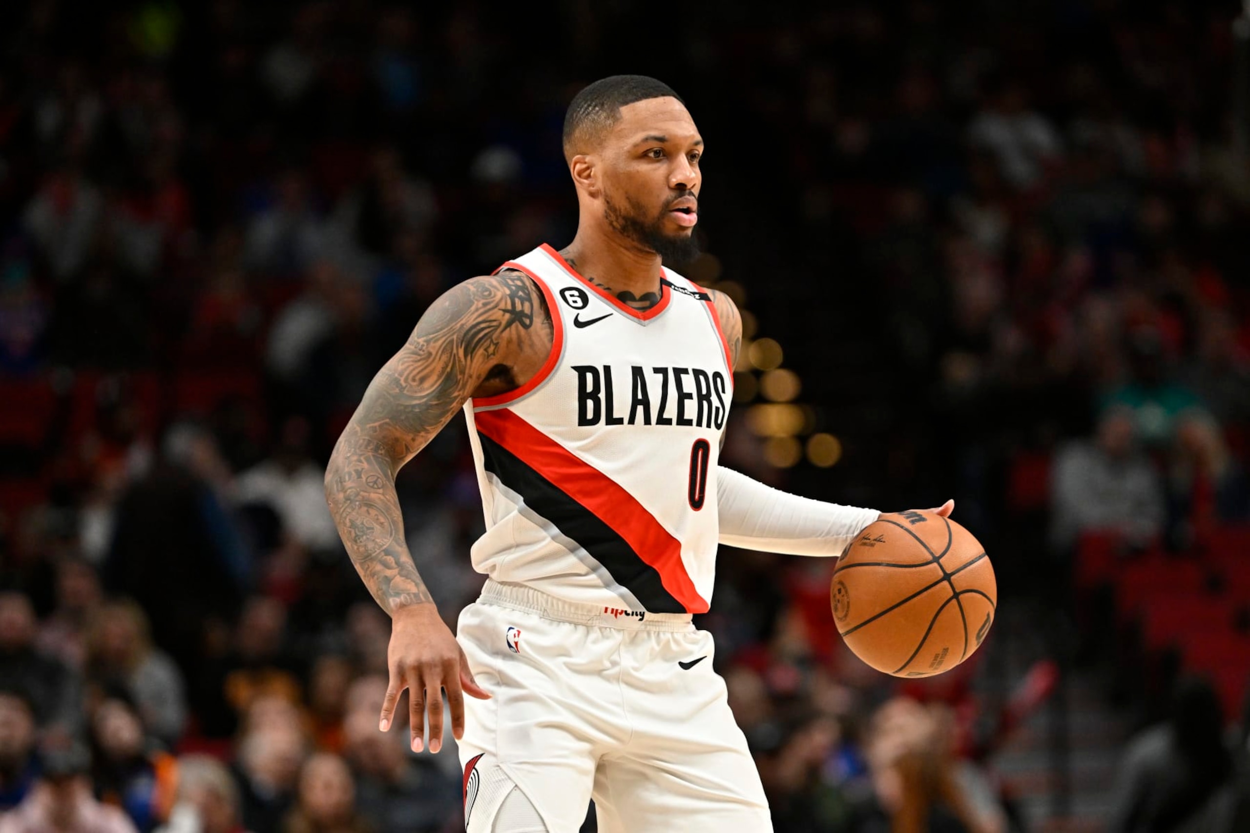 PORTLAND, OREGON - MARCH 14: Damian Lillard #0 of the Portland Trail Blazers dribbles during the first quarter against the New York Knicks at Moda Center on March 14, 2023 in Portland, Oregon. The New York Knicks won 123-107. NOTE TO USER: User expressly acknowledges and agrees that, by downloading and or using this photograph, User is consenting to the terms and conditions of the Getty Images License Agreement. (Photo by Alika Jenner/Getty Images)