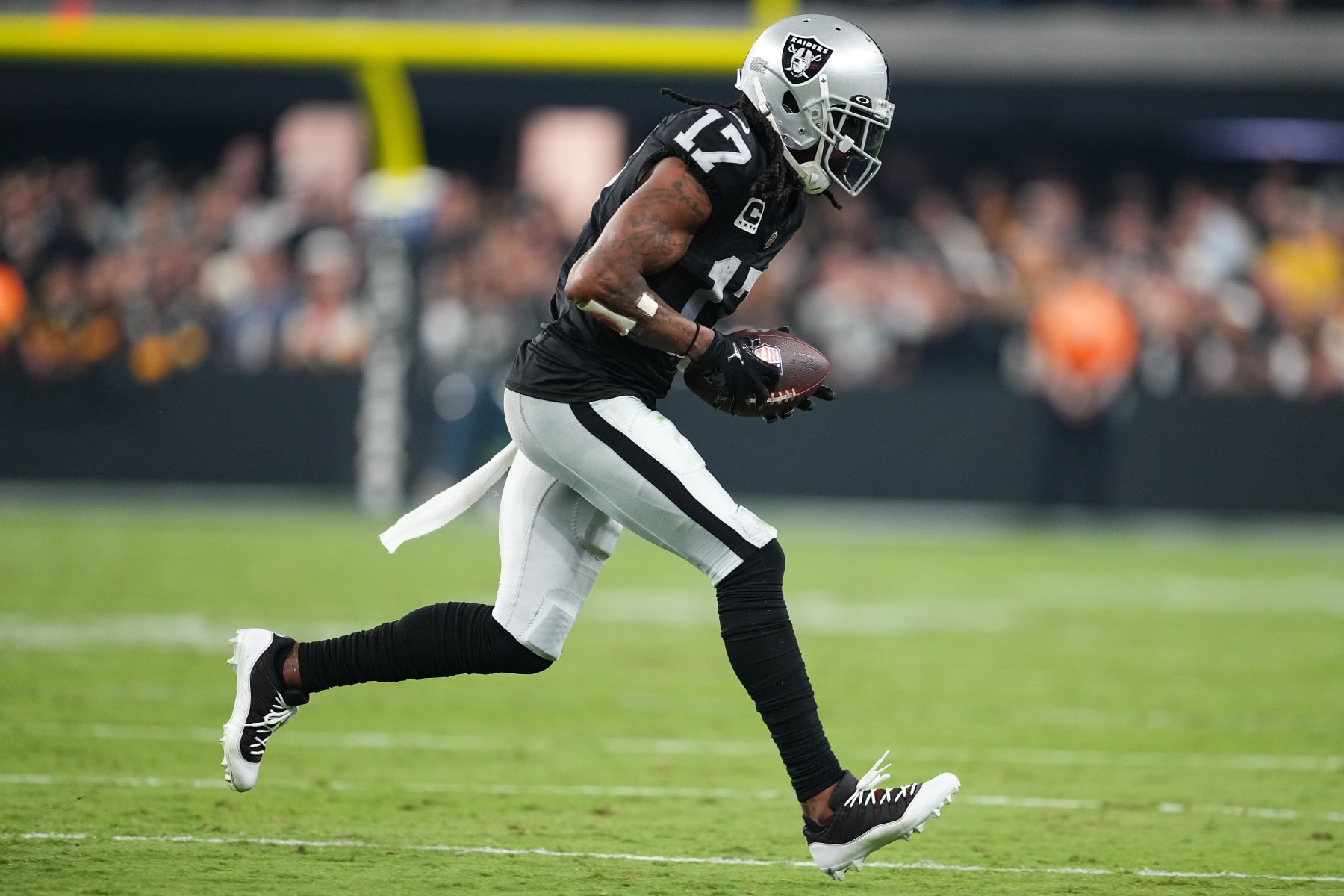 LAS VEGAS, NEVADA - SEPTEMBER 24: Davante Adams #17 of the Las Vegas Raiders runs the ball after a catch in the game against the Pittsburgh Steelers during the fourth quarter at Allegiant Stadium on September 24, 2023 in Las Vegas, Nevada. (Photo by Chris Unger/Getty Images)
