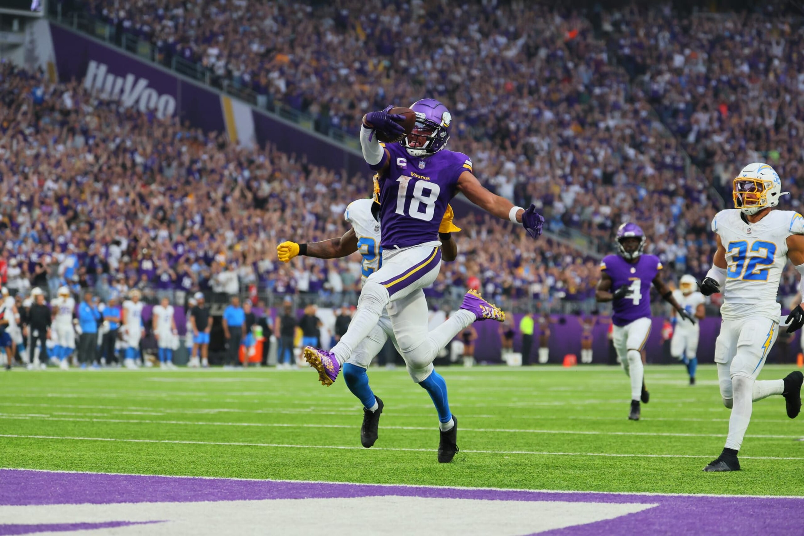 MINNEAPOLIS, MINNESOTA - SEPTEMBER 24: Justin Jefferson #18 of the Minnesota Vikings scores a touchdown against the Los Angeles Chargers at U.S. Bank Stadium on September 24, 2023 in Minneapolis, Minnesota.The Los Angeles Chargers defeated the Minnesota Vikings 28-24.  (Photo by Adam Bettcher/Getty Images)