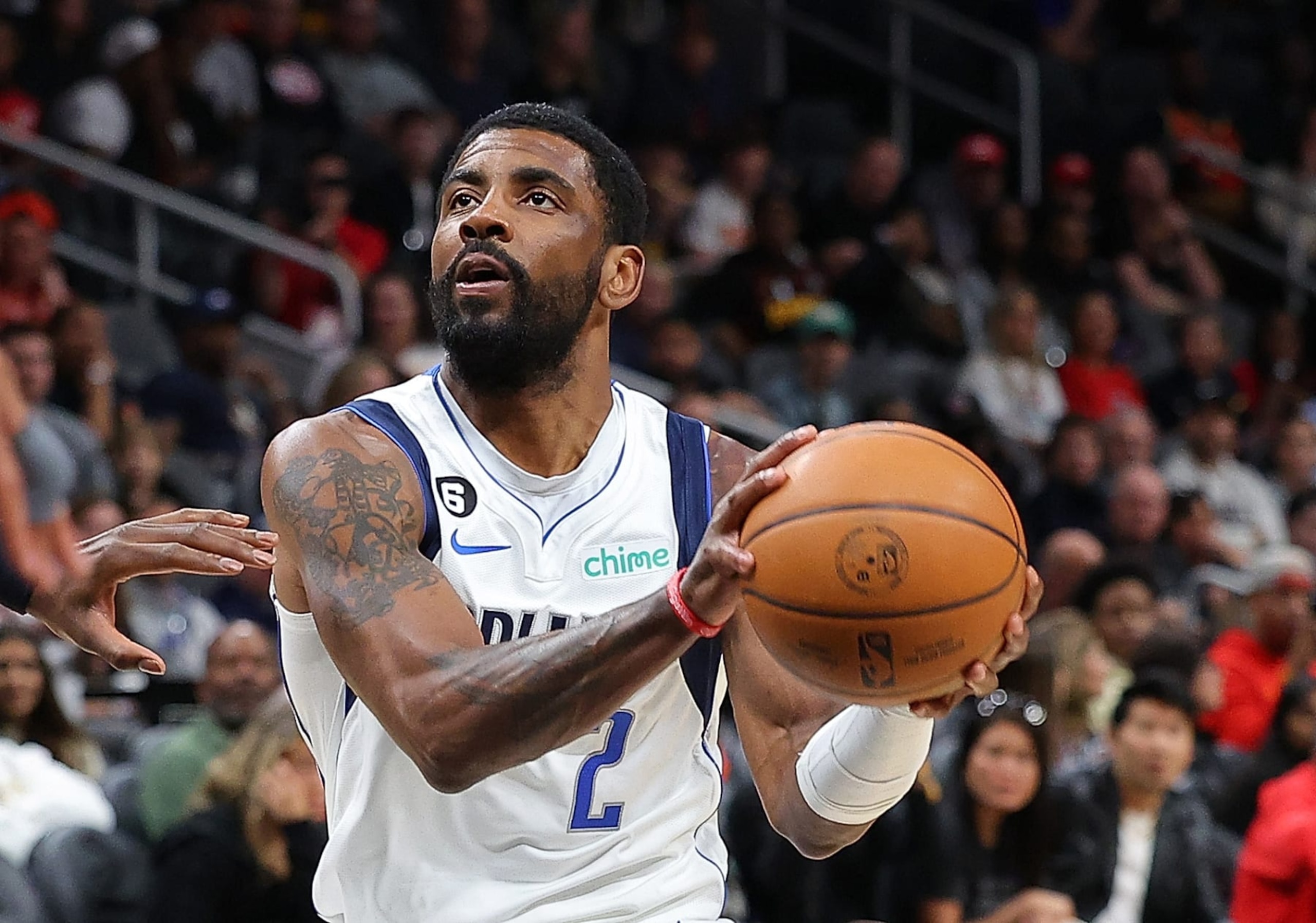 ATLANTA, GEORGIA - APRIL 02:  Kyrie Irving #2 of the Dallas Mavericks drives against the Atlanta Hawks during the first quarter at State Farm Arena on April 02, 2023 in Atlanta, Georgia.  NOTE TO USER: User expressly acknowledges and agrees that, by downloading and or using this photograph, User is consenting to the terms and conditions of the Getty Images License Agreement.  (Photo by Kevin C. Cox/Getty Images)