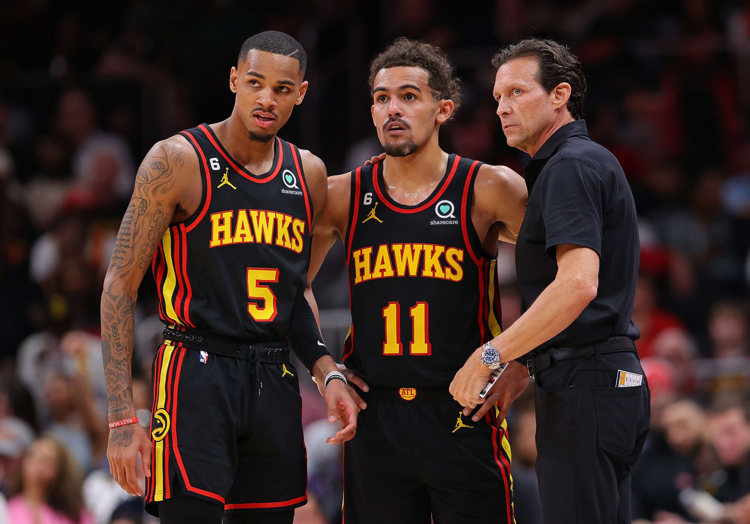 Dejounte Murray, Trae Young and coach Quin Snyder